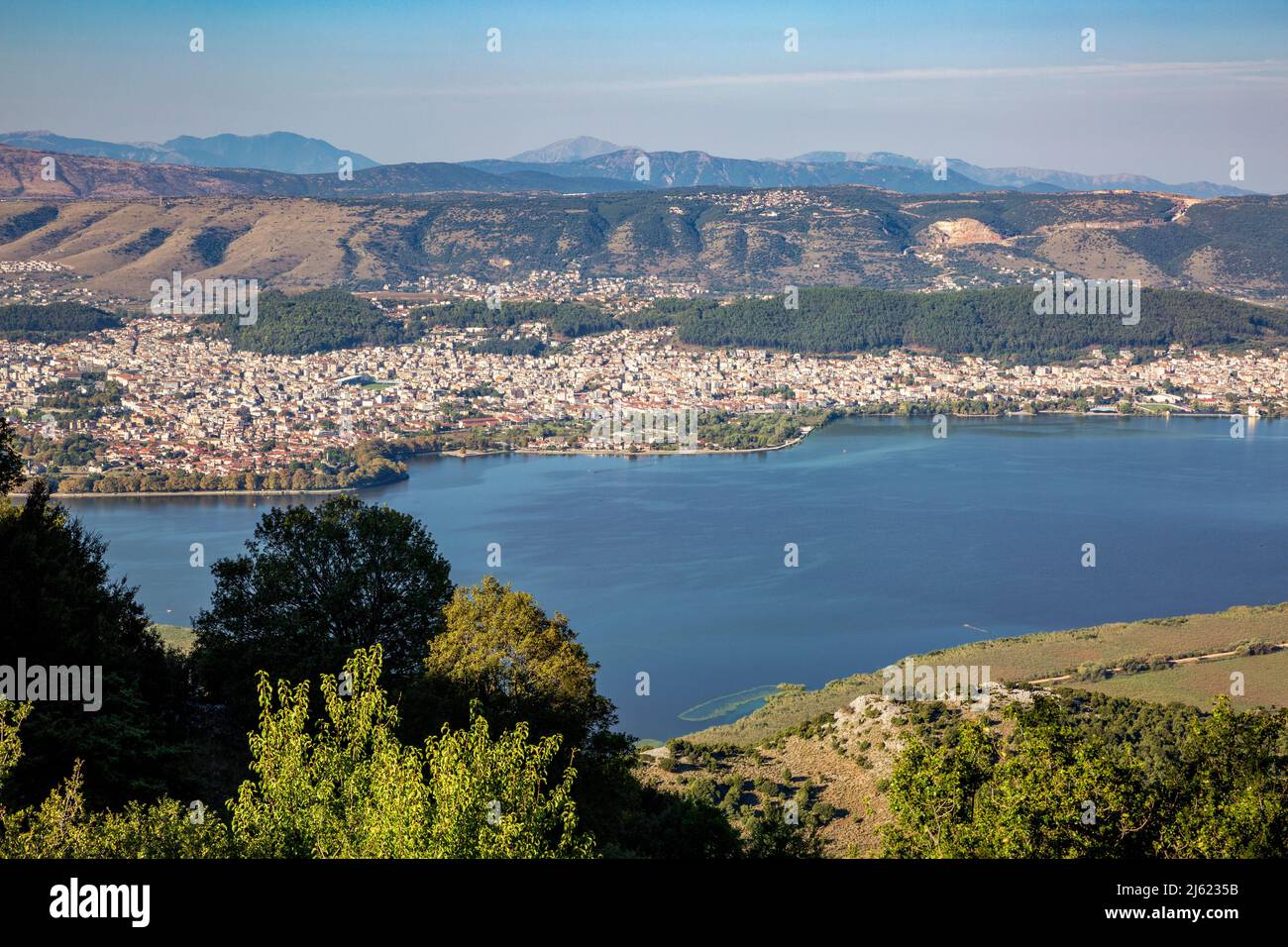 Greece, Epirus, Ioannina, View of Lake Pamvotida and surrounding city in summer Stock Photo