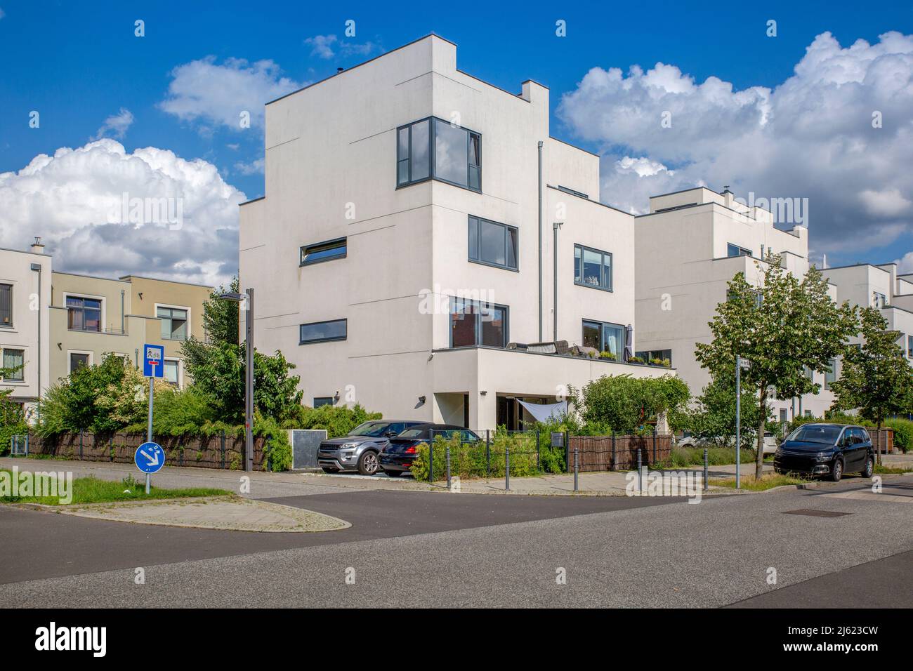 Germany, Berlin, Street in front of modern suburban houses in new development area Stock Photo