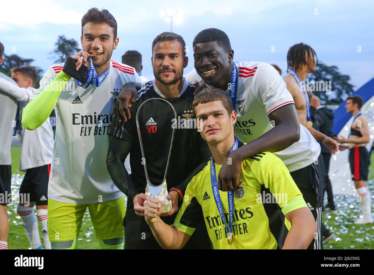 Nyon, Switzerland, 25th April 2022. Ricardo Ribeiro, Vitor Dimas ( goalkeeping coach ), Samuel Soares and Andre Gomes of SL Benfica pose with the trophy following the 6-0 victory in the UEFA Youth League match at Colovray Sports Centre, Nyon. Picture credit should read: Jonathan Moscrop / Sportimage Stock Photo