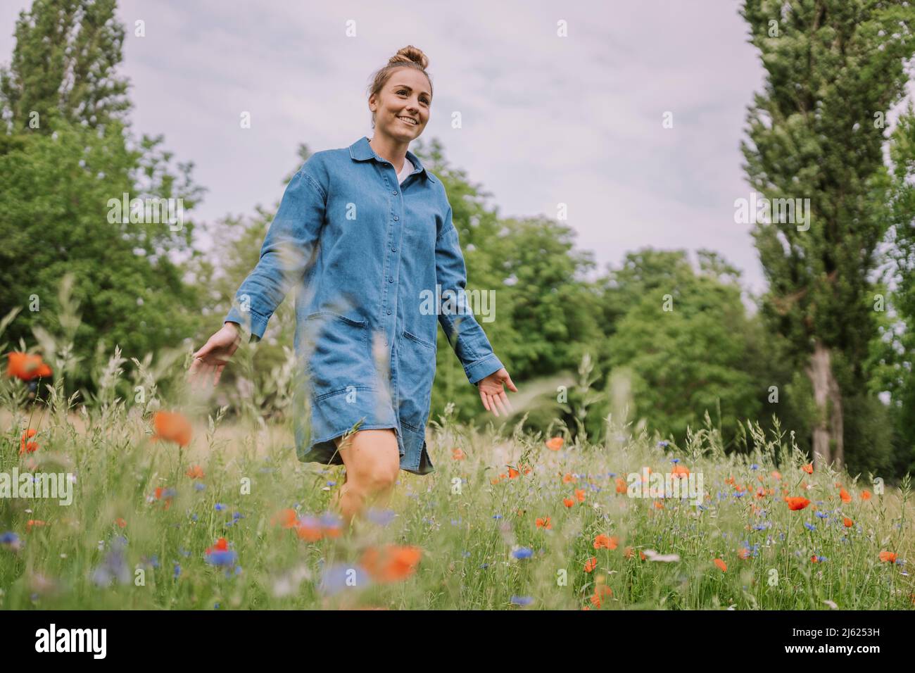Young caucasian blond woman walking hi-res stock photography and images ...