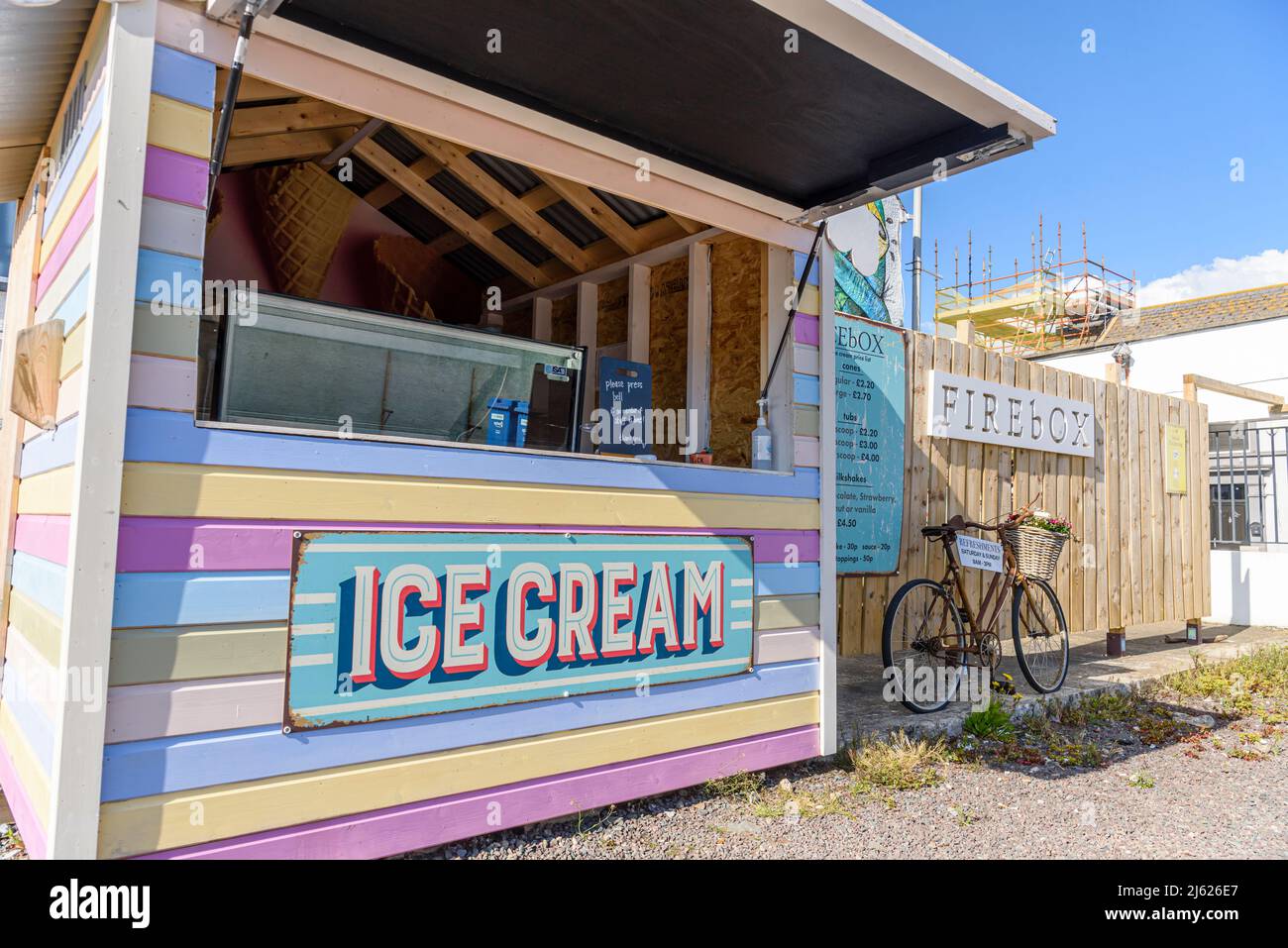 Ice cream stall with multicoloured decoration on the street in Ballywalter, Strangford, Northern Ireland. Stock Photo