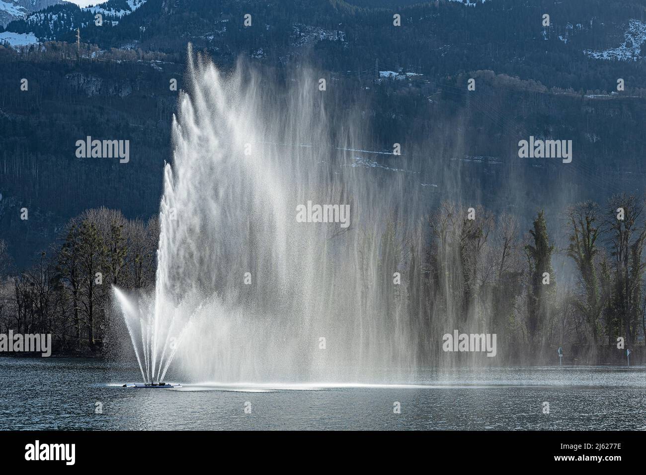 Water fountain in Lake Walen, near Weesen, Canton St.Gallen, Switzerland Stock Photo