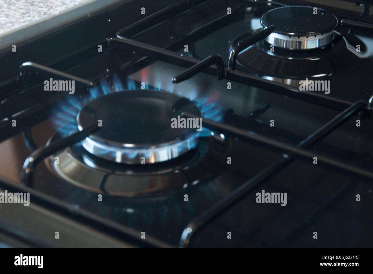 Gas Cooker, burner lit Stock Photo Alamy