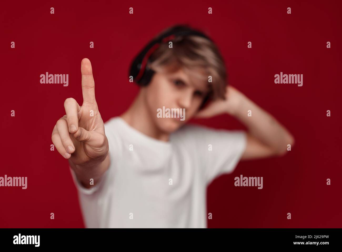 man with headphones pressing button on virtual screens Stock Photo