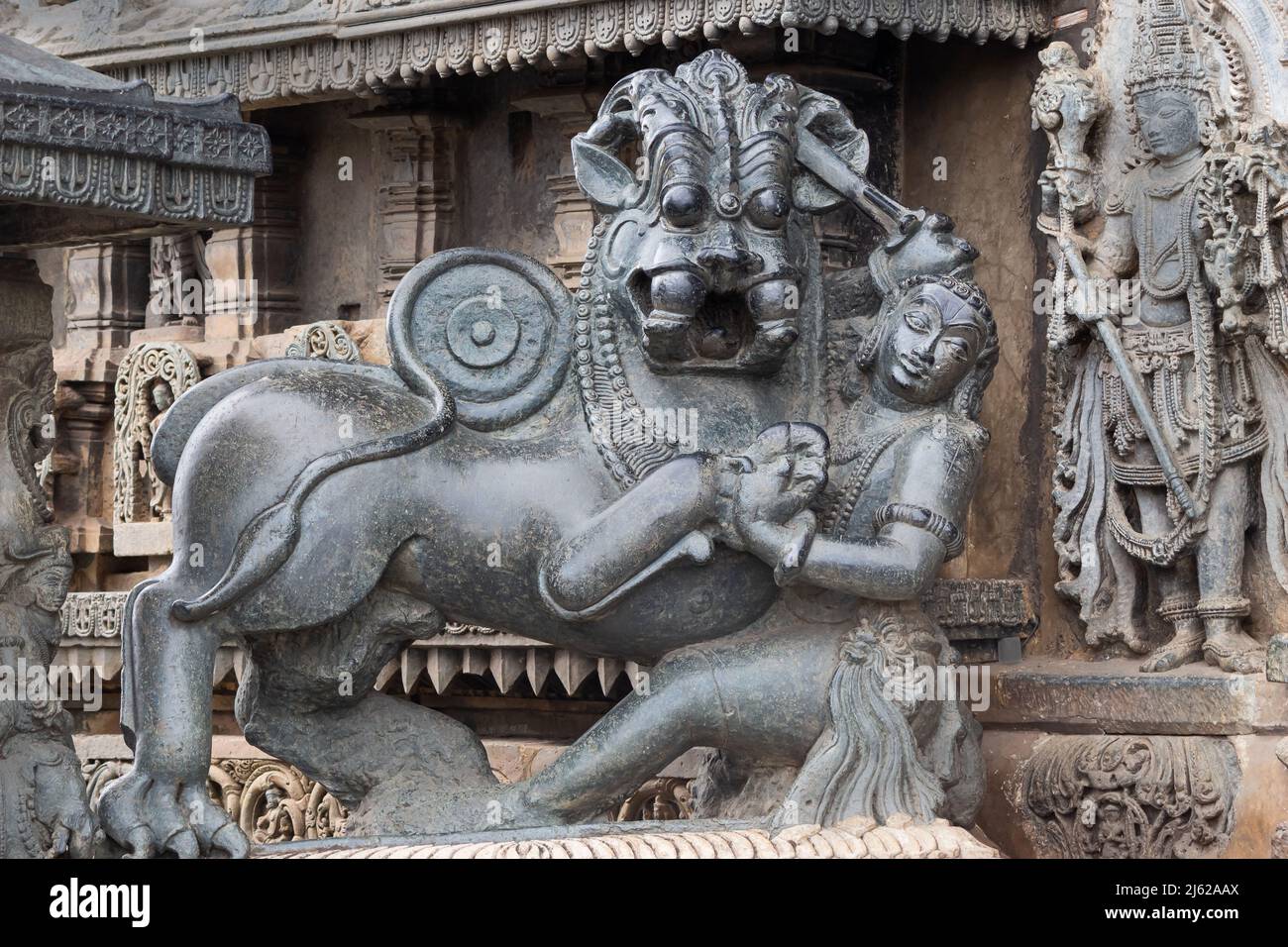 Stone carved human and animal figures on outer walls of Chennakesava Temple in Belur, Karnataka, India Stock Photo