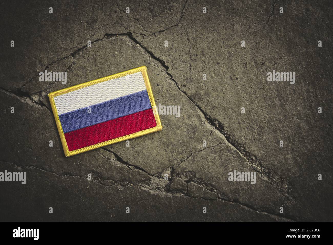 Flag Of Russia On Broken Ground Stock Photo