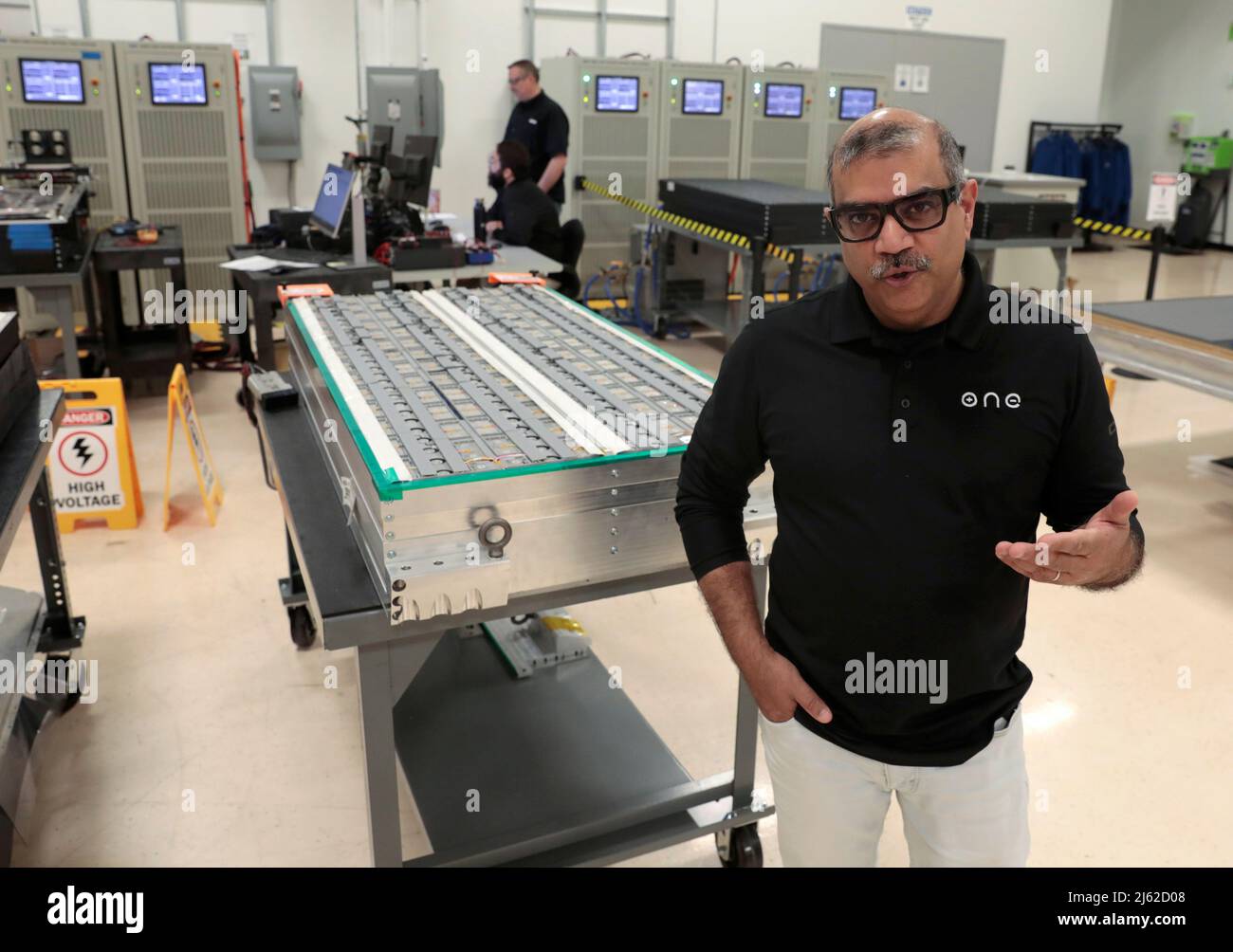 Our Next Energy (ONE) CEO Mujeeb Ijaz speaks next to Aries lithium iron phosphate battery packs waiting to undergo testing at ONE's headquarters in Novi, Michigan, U.S., April 25, 2022. Photo taken April 25, 2022. REUTERS/ Rebecca Cook Stock Photo