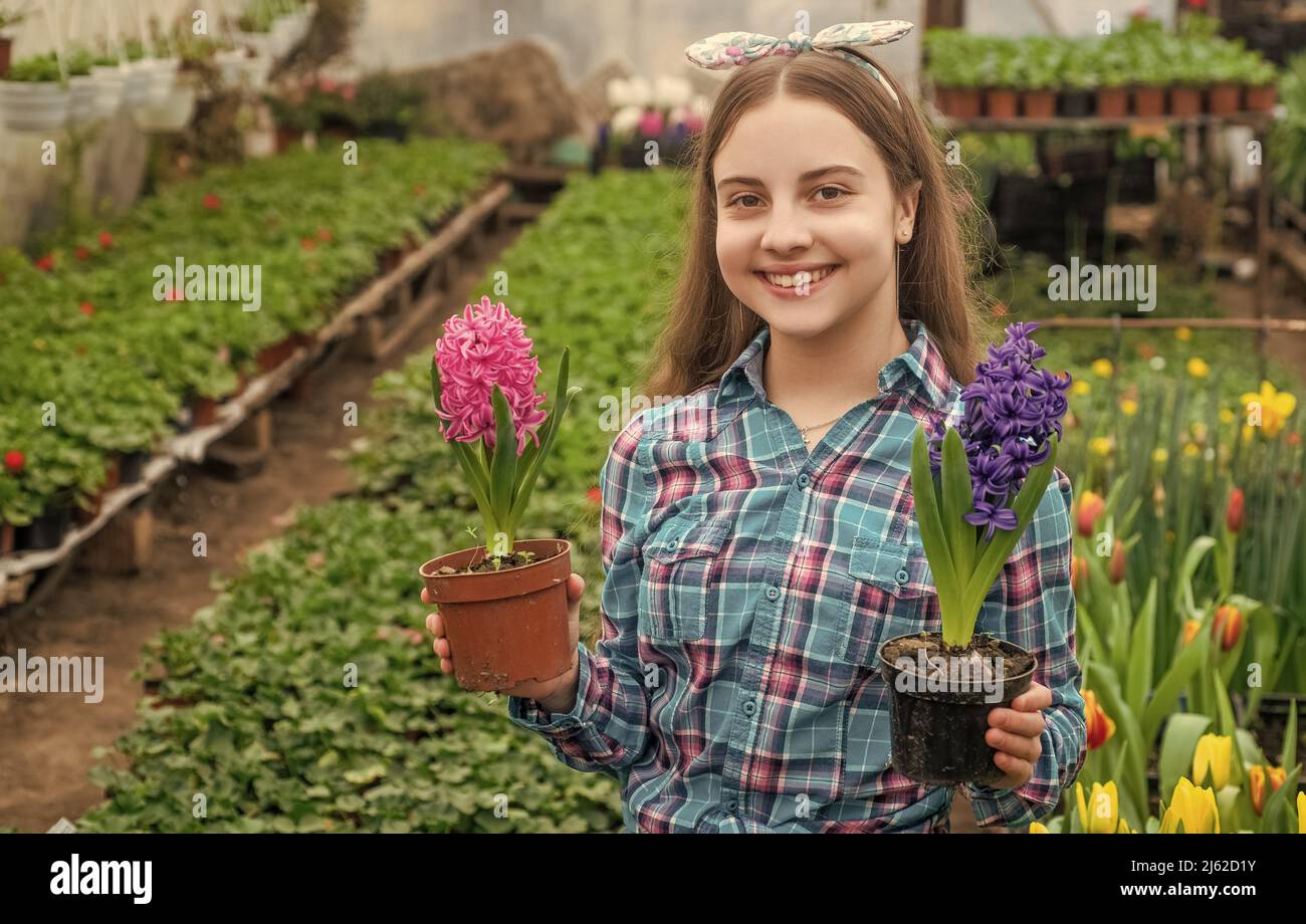 Teen girl plant in greenhouse hi-res stock photography and images - Alamy