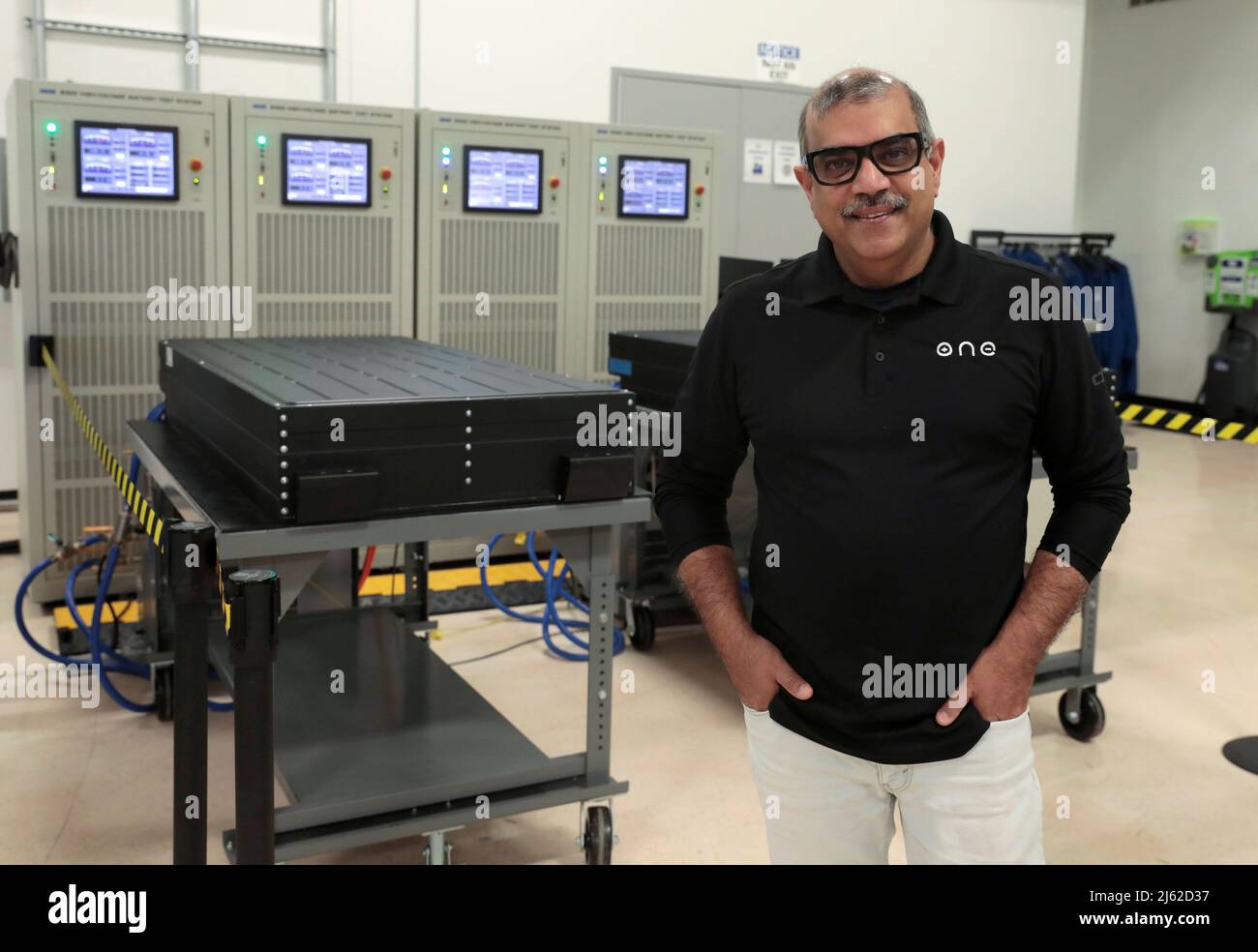 Our Next Energy (ONE) CEO Mujeeb Ijaz stands next to Aries lithium iron phosphate battery packs waiting to undergo testing at ONE's headquarters in Novi, Michigan, U.S., April 25, 2022. Photo taken April 25, 2022. REUTERS/ Rebecca Cook Stock Photo