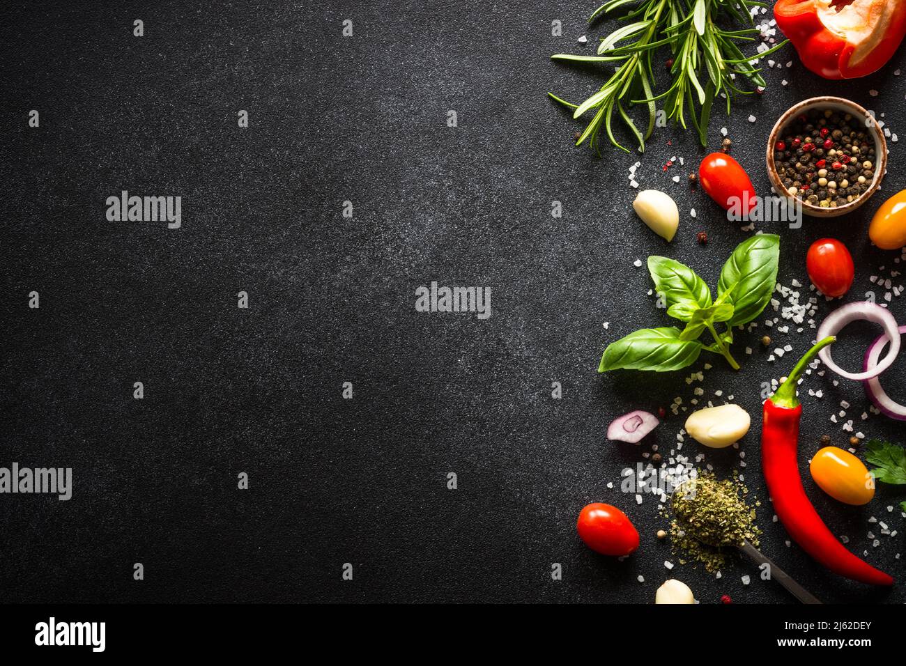 Food cooking background on black stone table Stock Photo Alamy