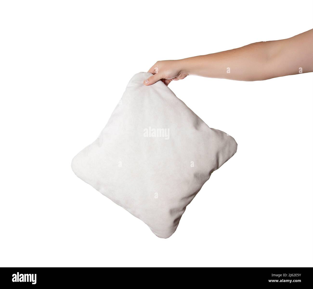 Gray pillow in a man's hand on a white background, isolate. Close-up, comfortable Stock Photo