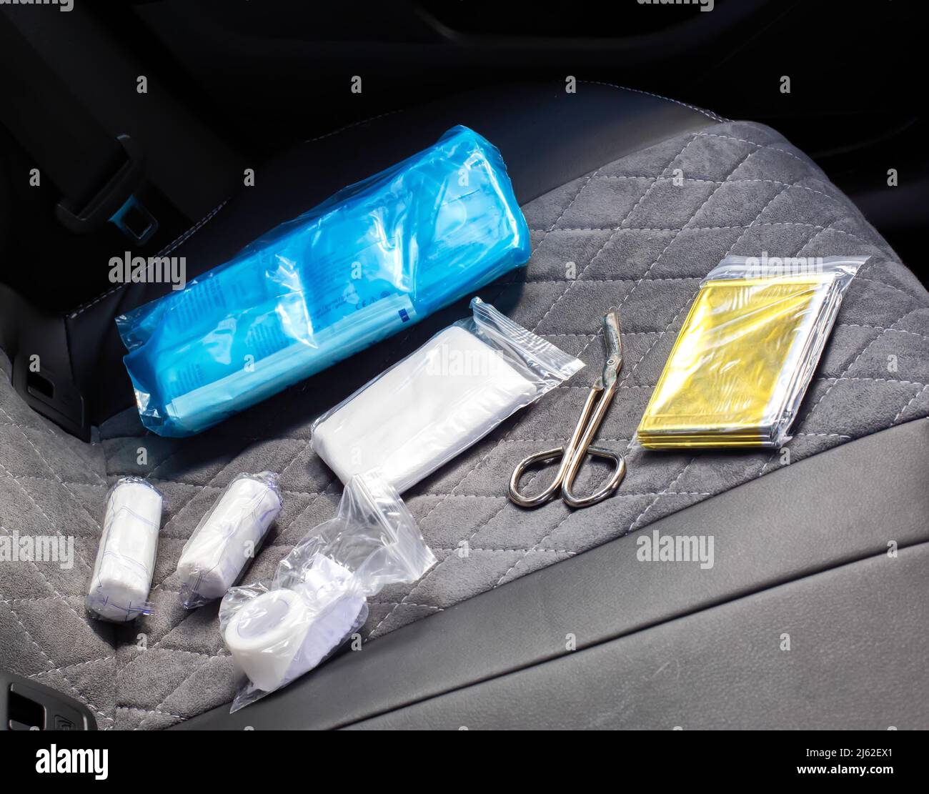 car first aid kit on the car seat. The list of medicines and the shelf