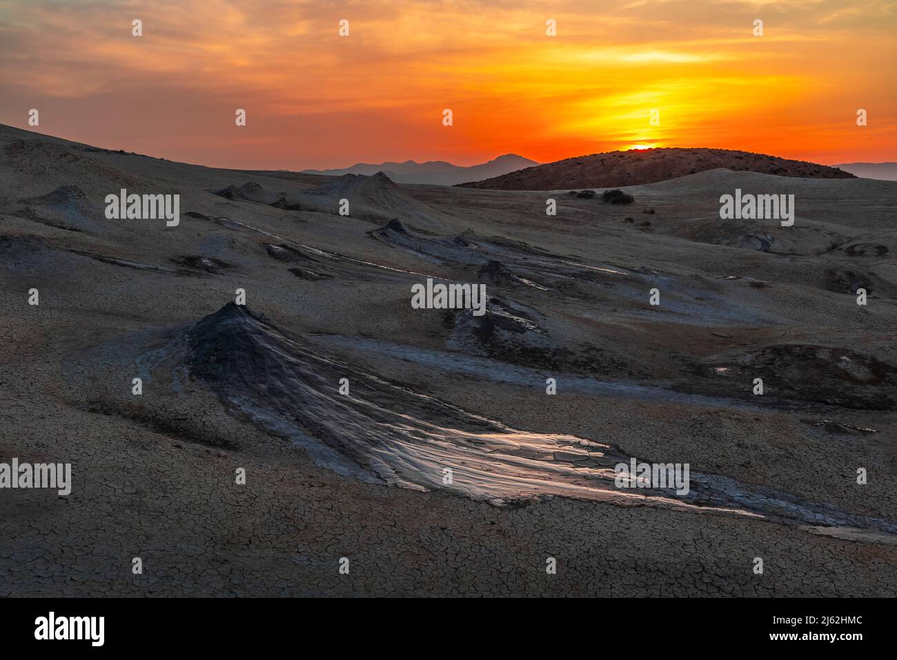 Dramatic view of the mud volcano at sunset time Stock Photo