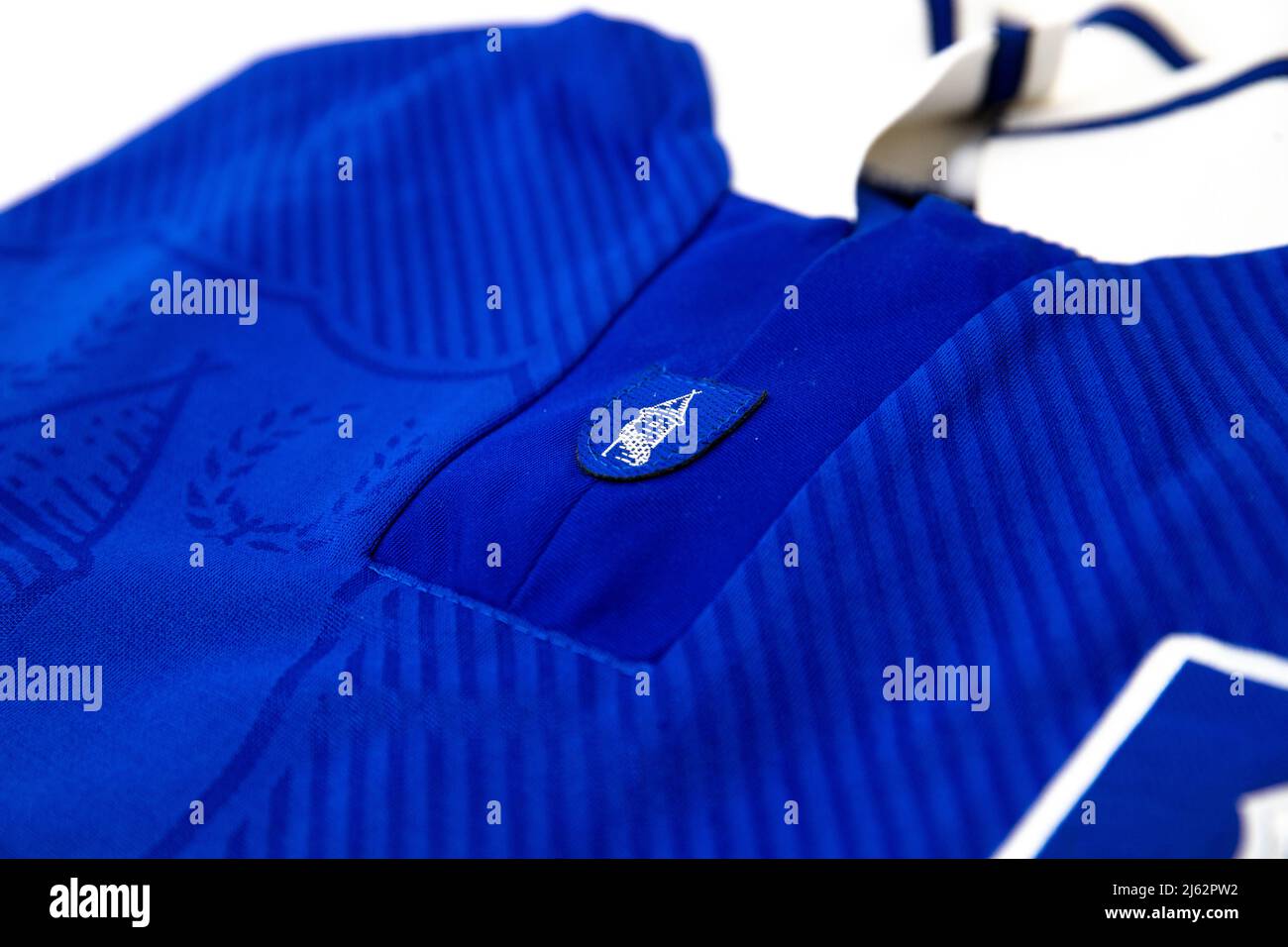 Everton castle icon on a blue folded Umbro football shirt Stock Photo