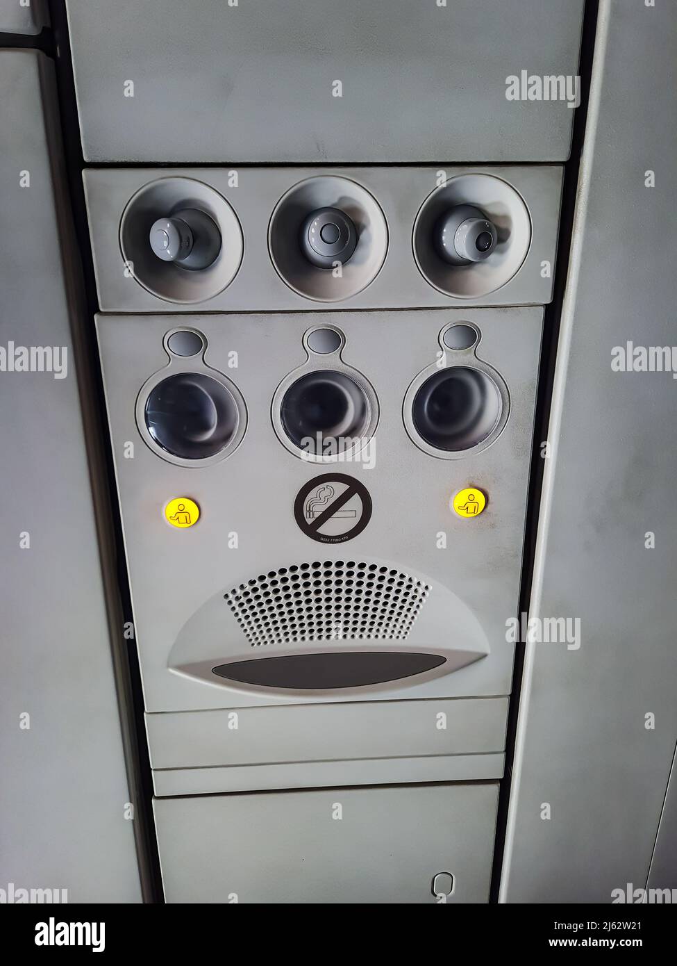 aircraft ac vent with assistance button and light sounds from low angle image is taken at vistara flight delhi india on Mar 05 2022. Stock Photo