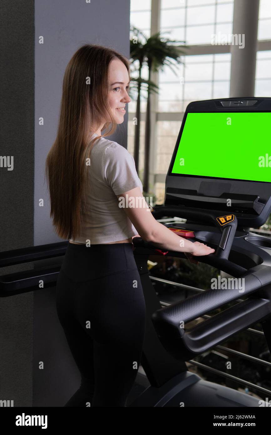 Indoors young woman length treadmill profile full running sport, from fitness attractive from caucasian for machine sporty, runner beautiful. White Stock Photo