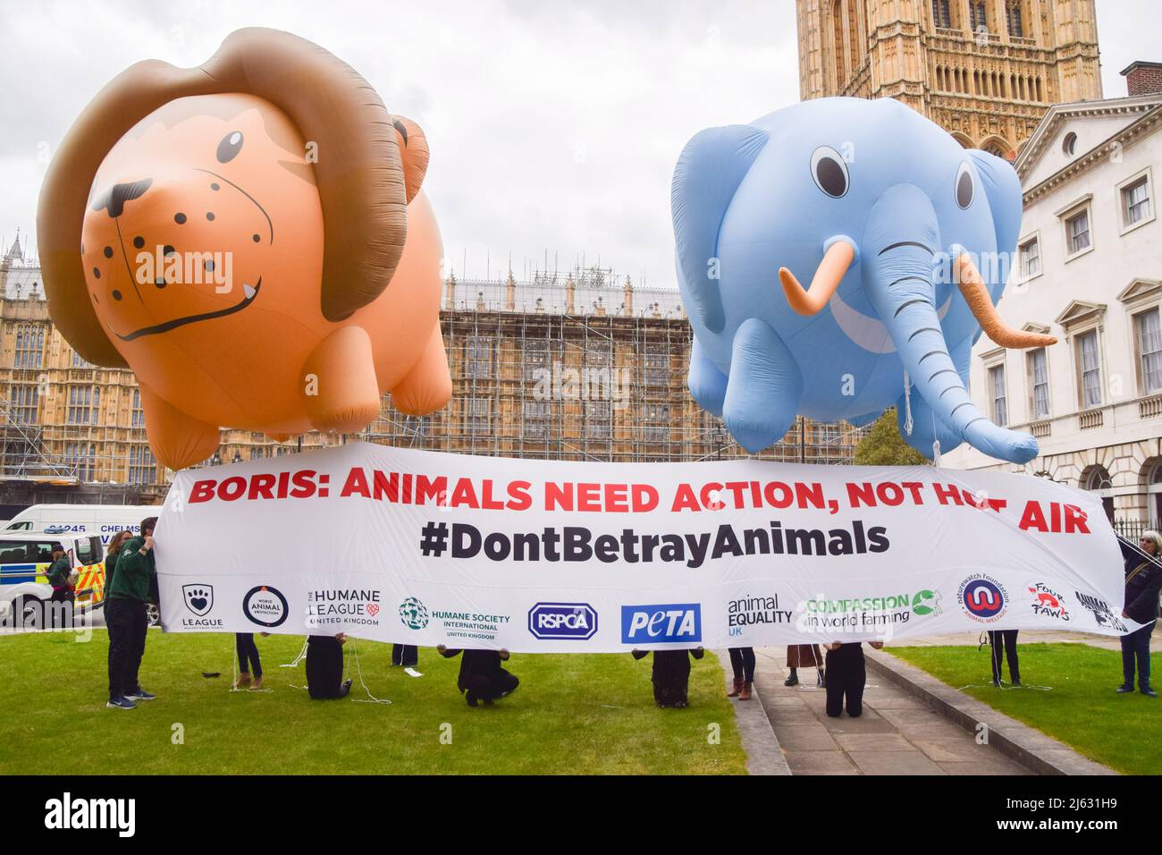 London, England, UK. 27th Apr, 2022. Various animal welfare organisations gathered outside Parliament and flew huge lion and elephant balloons in response to reports that the government will drop the Animals Abroad Bill. The organisations are calling on the government to go through with their promise to ban the import of hunting ''˜trophies', fur and foie gras to the UK, and the promotion of tourist elephant rides abroad. (Credit Image: © Vuk Valcic/ZUMA Press Wire) Credit: ZUMA Press, Inc./Alamy Live News Stock Photo