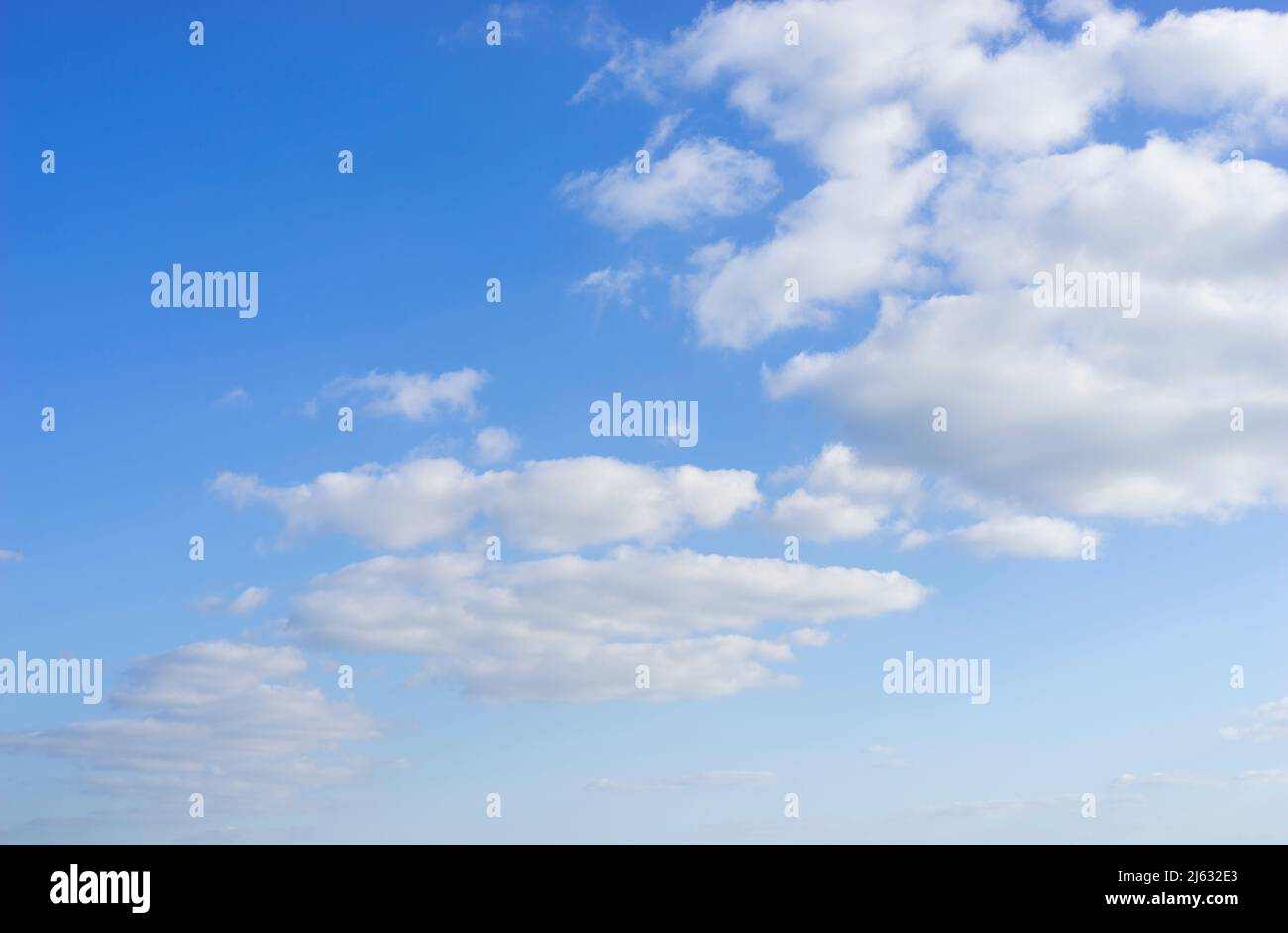 blue sky clouds in a Blue sky with white fluffy clouds background white clouds blue sky white clouds only uk Stock Photo