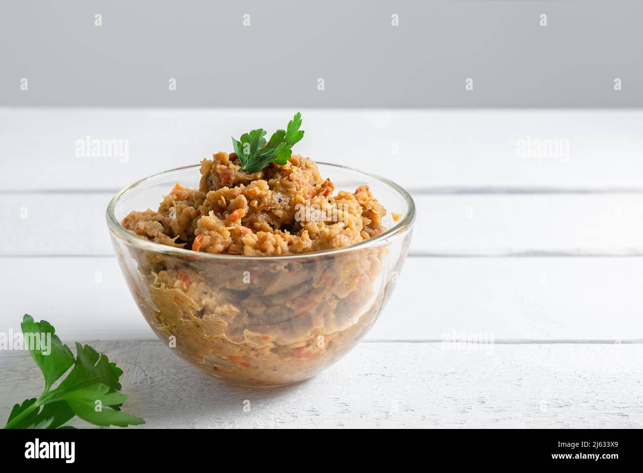 Kiopoolu, smoked eggplant dip in a glass bowl on white table with copy space Stock Photo