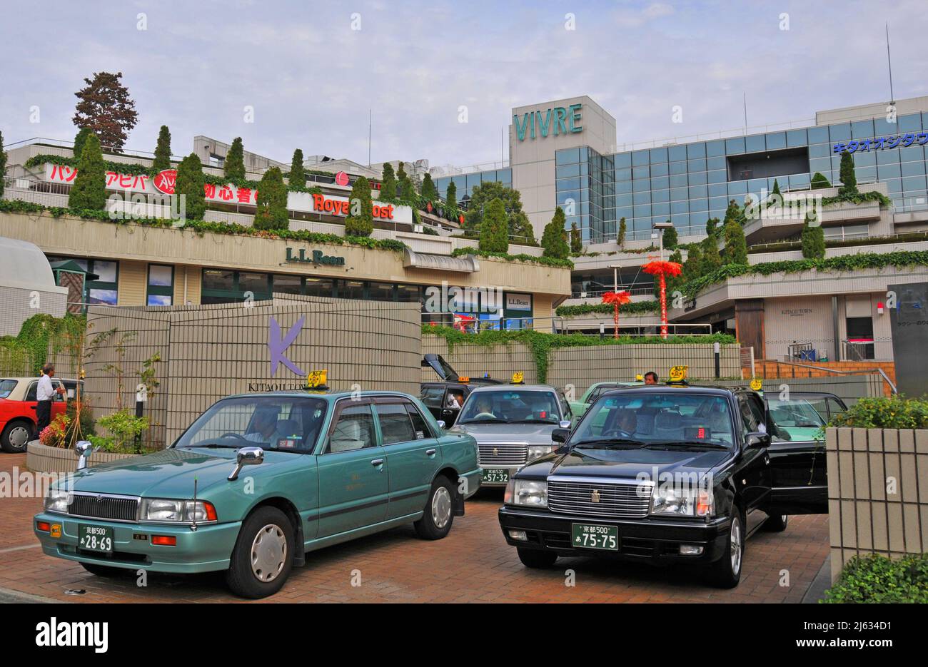 taxis before Vivre shopping mall, Kyoto, Japan Stock Photo