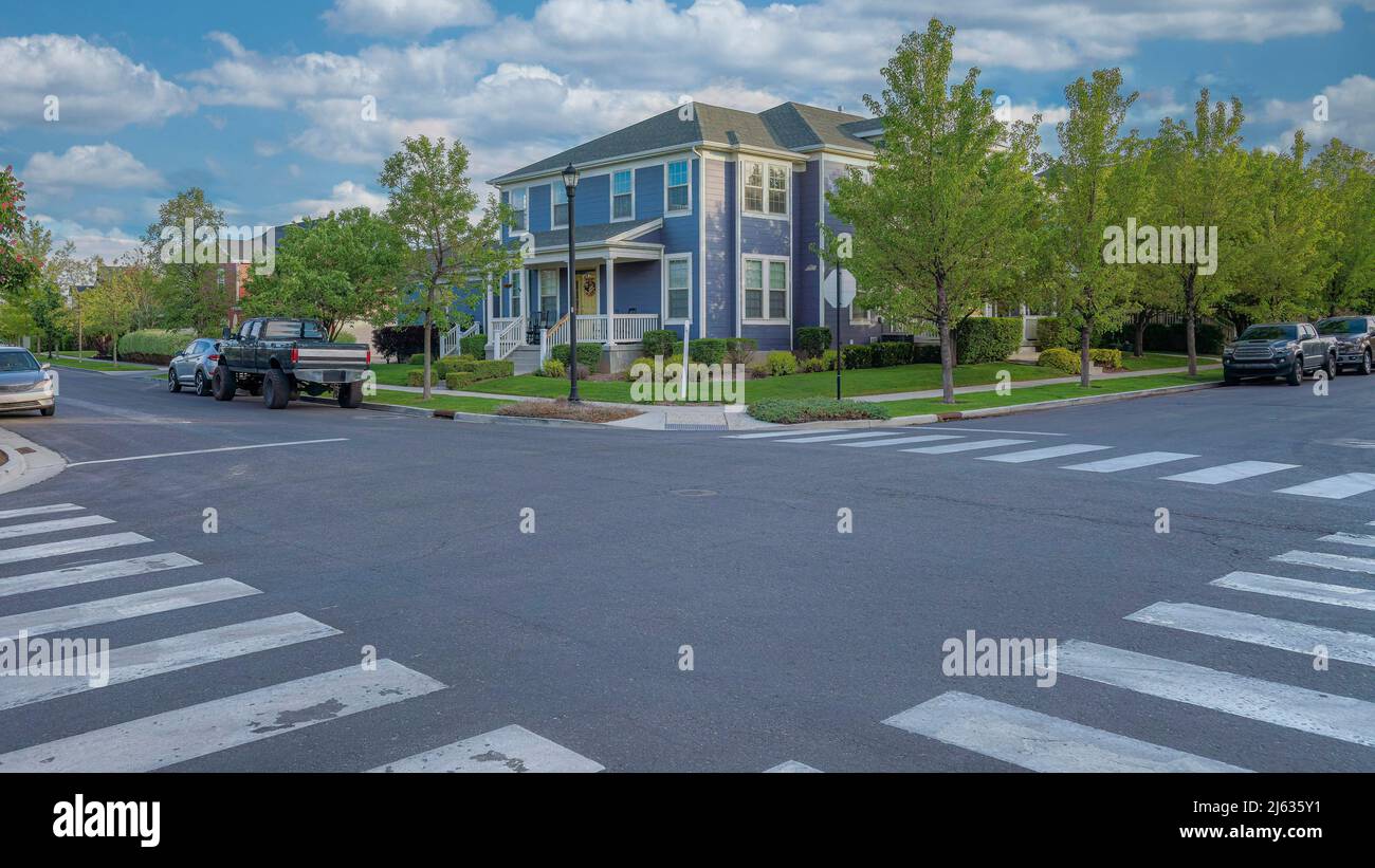 Panorama White puffy clouds Crosswalk at the intersection road in a ...