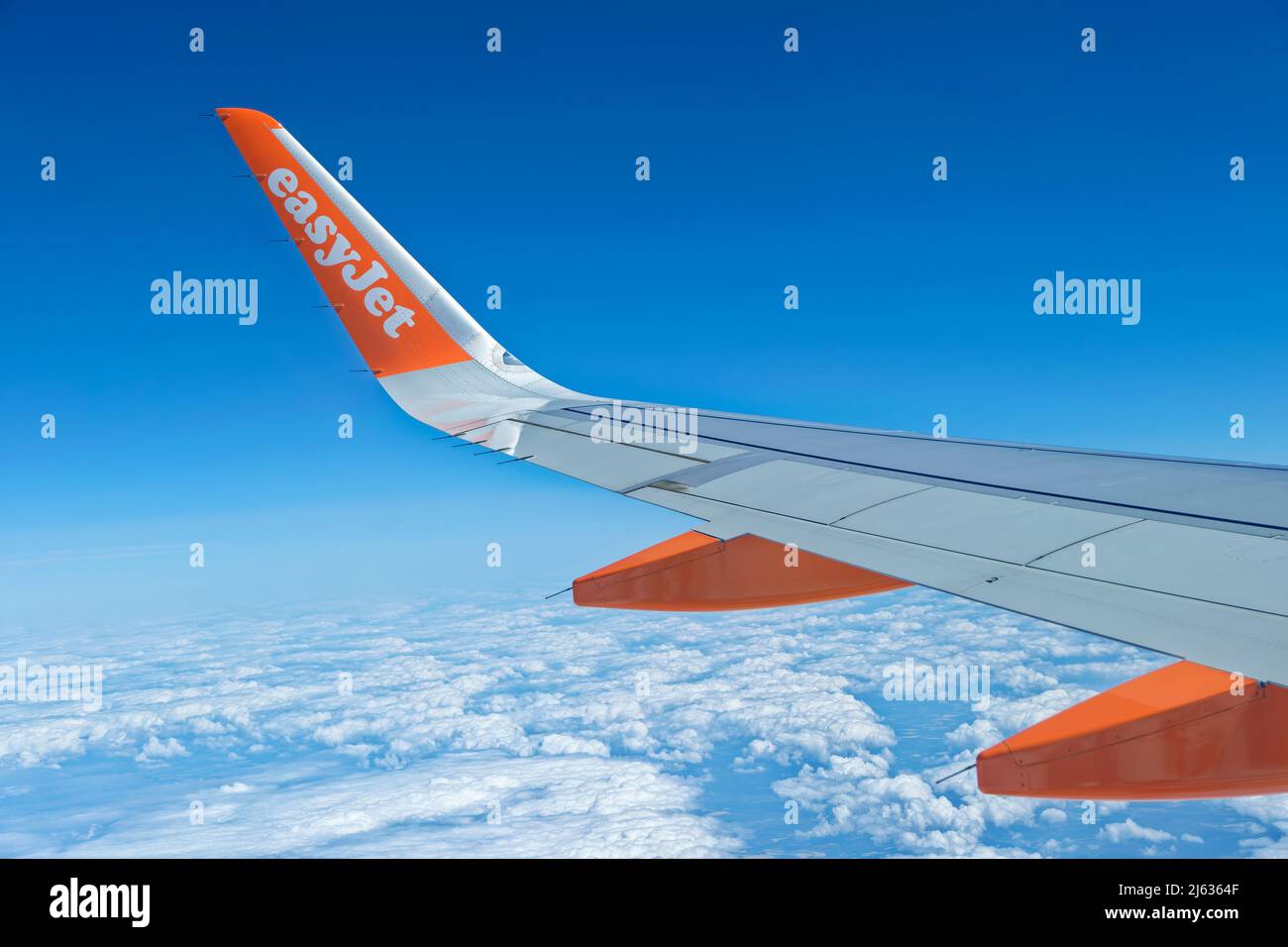 Easyjet Airbus A320-214 wing detail in flight. Stock Photo