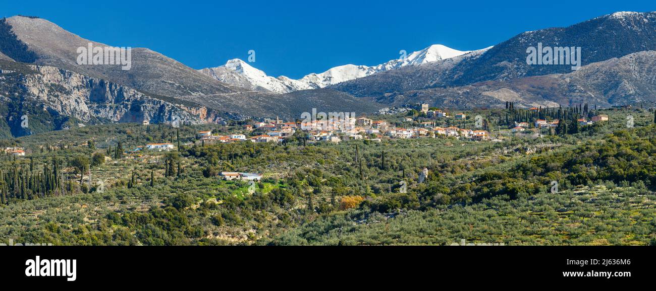Dollei village in the Mani peninsula of the Peloponnese of Greece with the Taygetos mountains as a backdrop Stock Photo