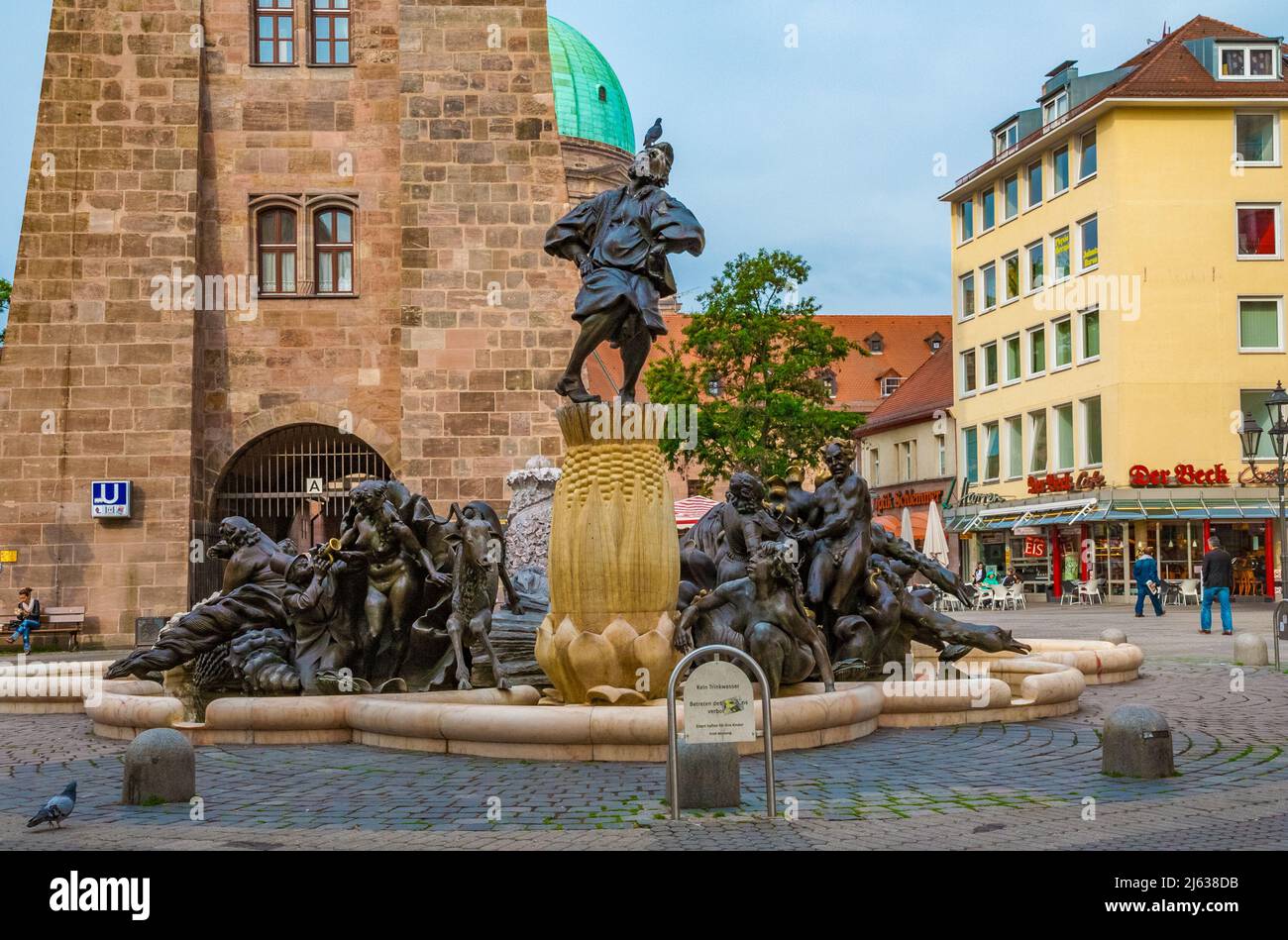 The famous bronze fountain in front of the White Tower, the Ehekarussell or Marriage-Merry-Go-Round in Nürnberg. The sculptural composition relates to... Stock Photo