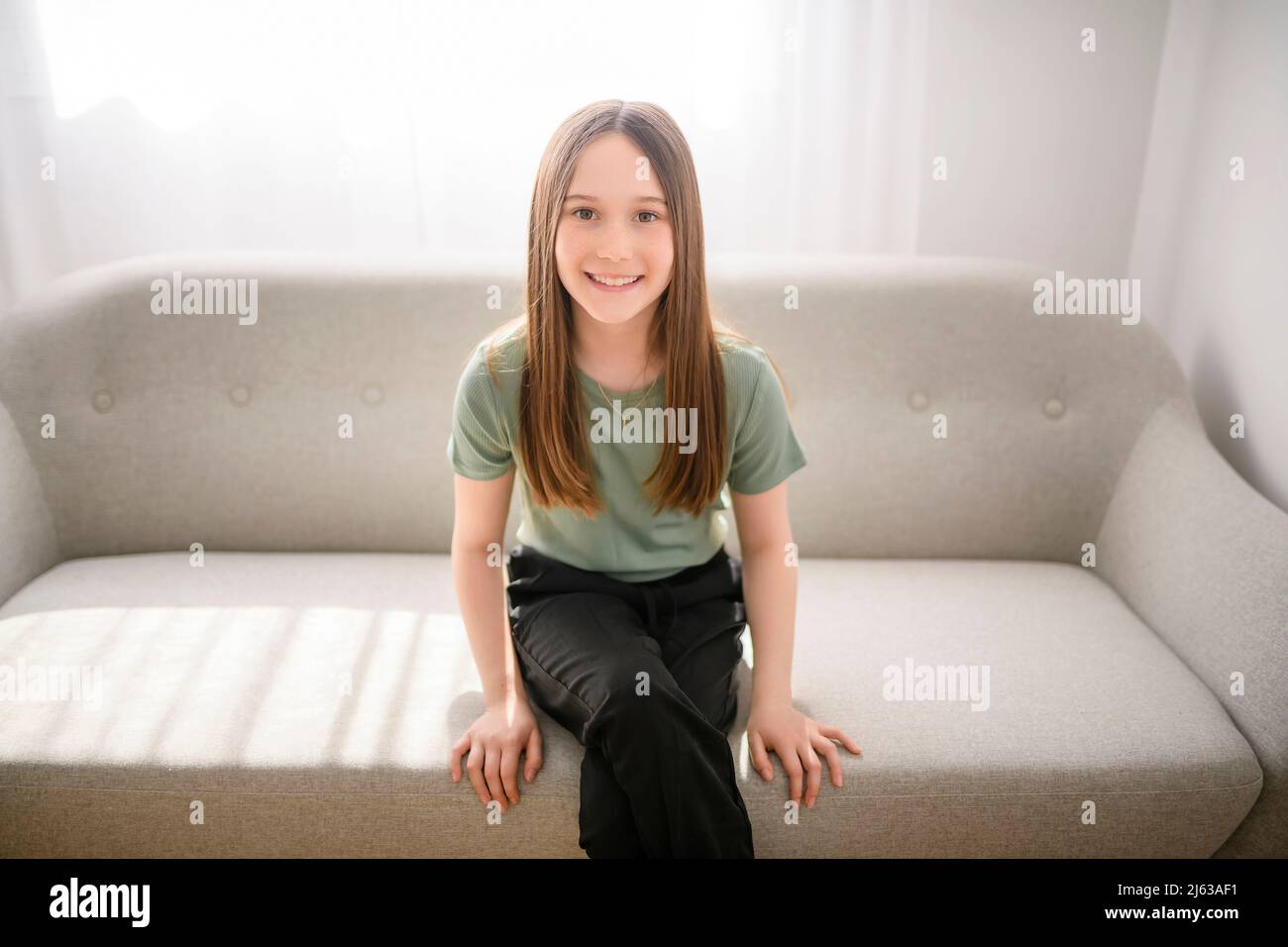 Pre teen girl sofa hi-res stock photography and images - Alamy