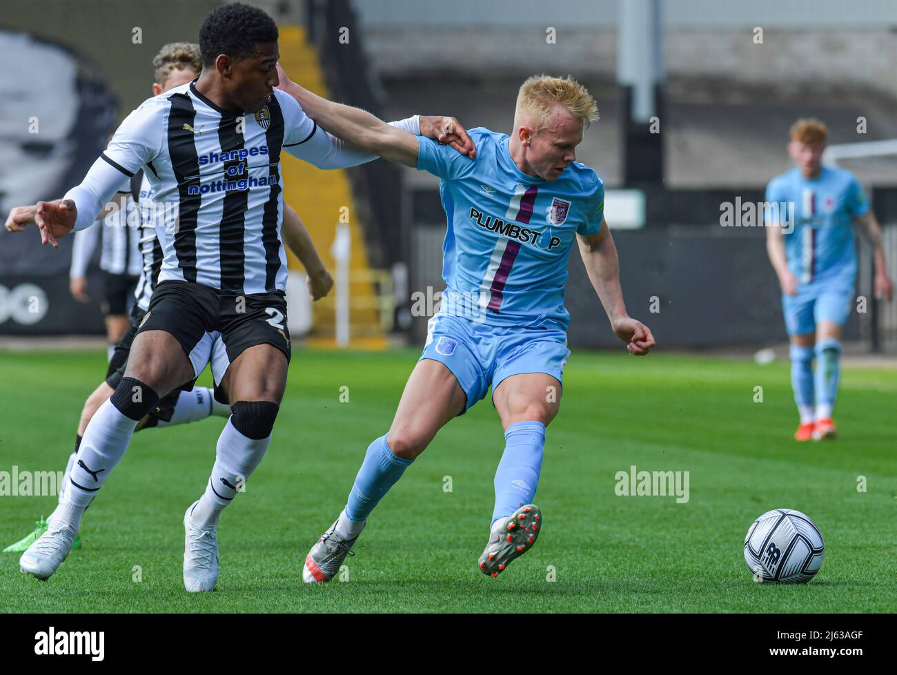 Xander McBurnie of Weymouth tackles Richard Brindley of Notts County