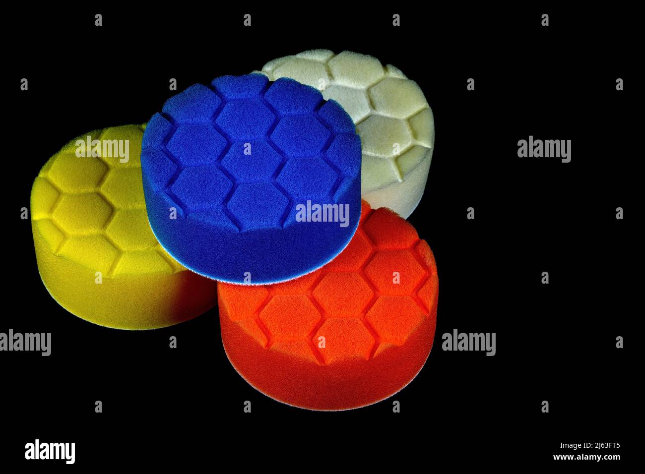 Circular plastic foam polishing pads isolated on a black background Stock Photo