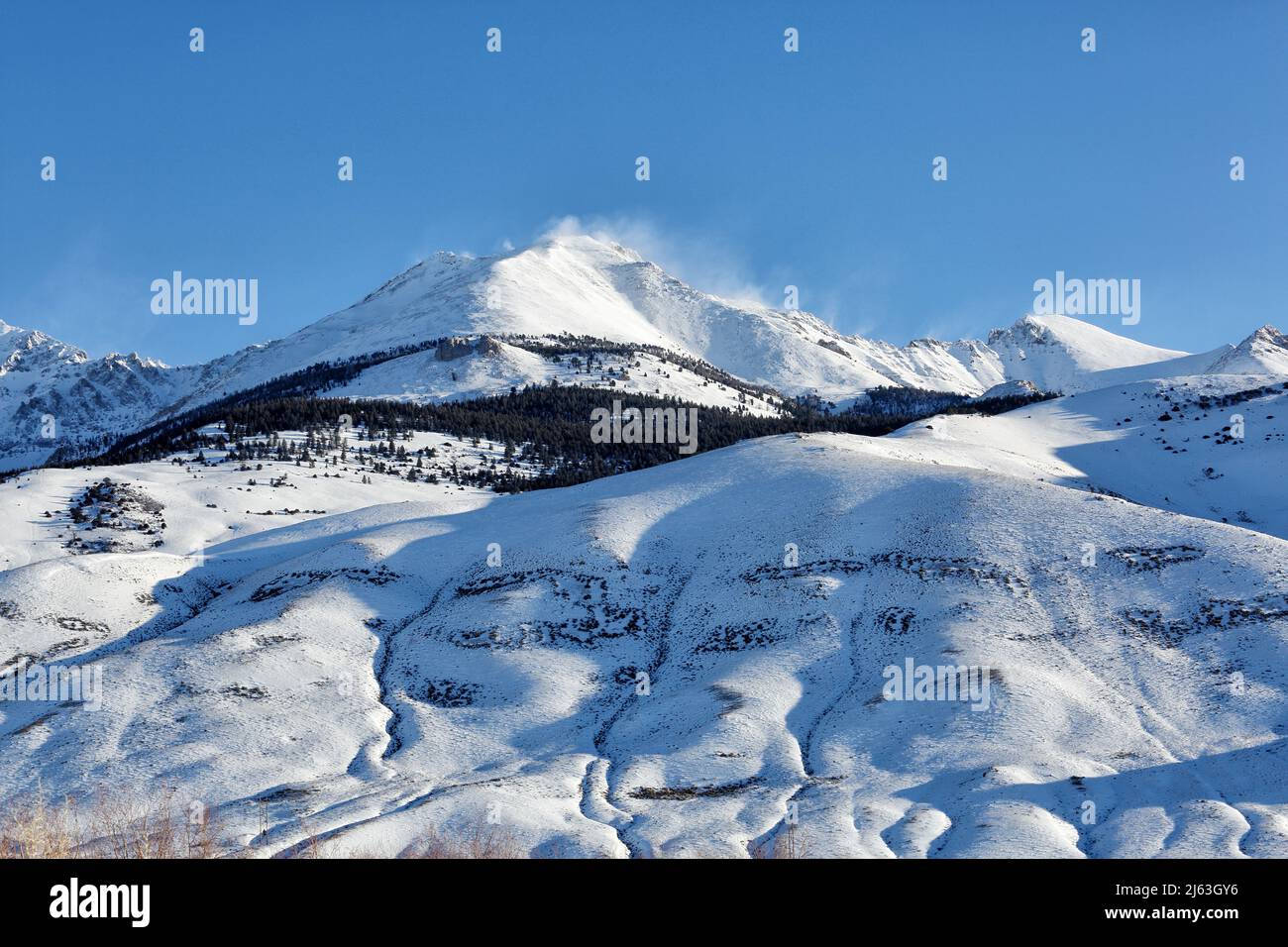 A snow covered mountain during a harsh Idaho Winter, holds the snow-pack that will provide water throughout the year.. Stock Photo
