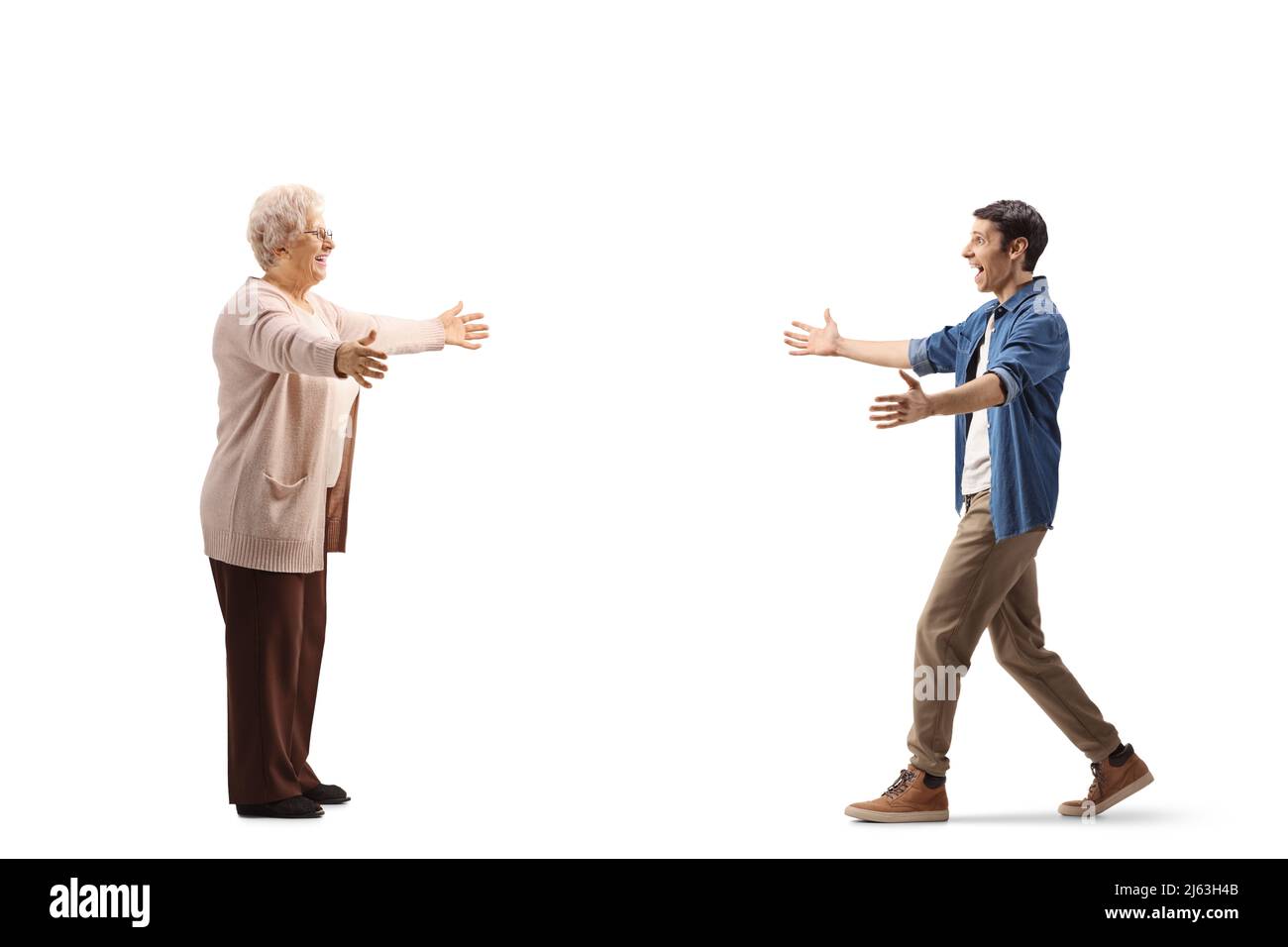 Full length profile shot of a young man walking towards an elderly ...