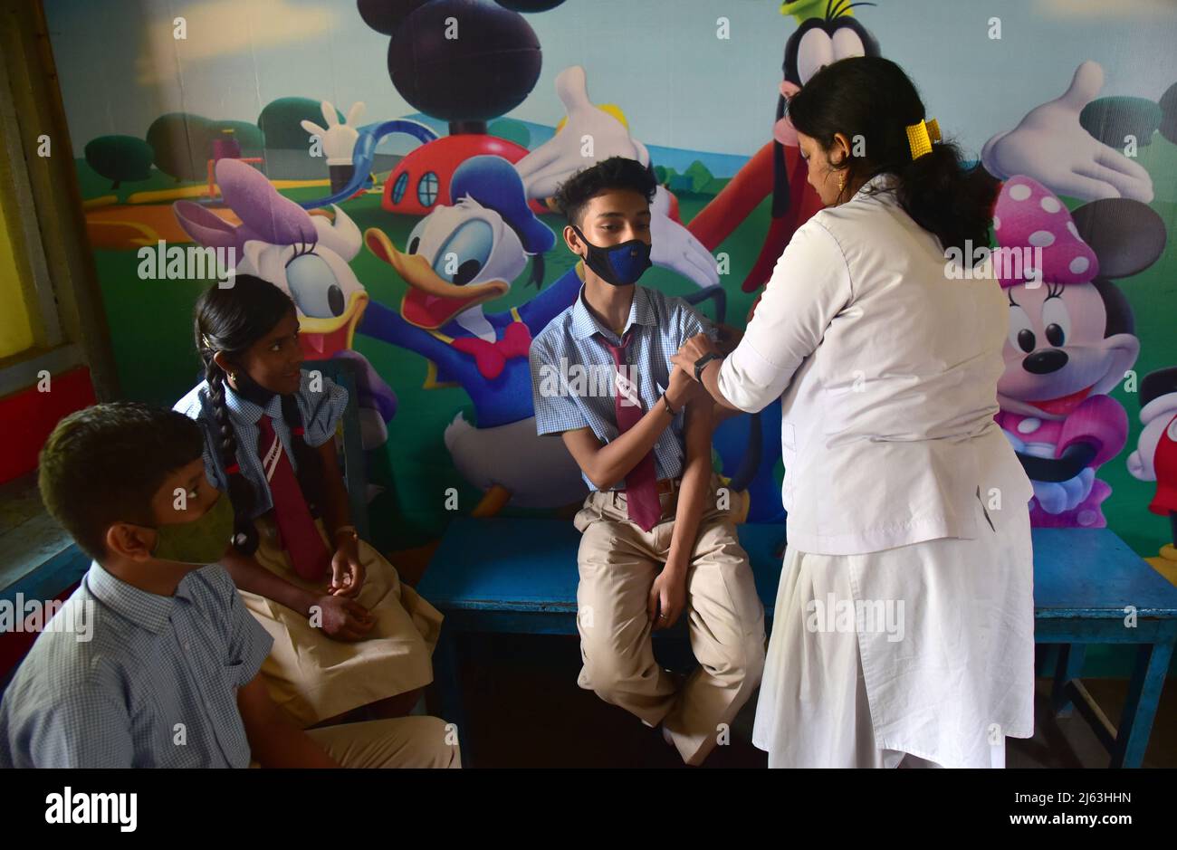 Guwahati, Guwahati, India. 27th Apr, 2022. A Nurse inject COVID-19 injection to student of age group 12 to 14 years old at Junior Commonwealth High School in Guwahati Assam India on Wednesday Guwahati, Guwahati, India. 27th Apr, 2022. A Nurse inject COVID-19 injection to student of age group 12 to 14 years old at Junior Commonwealth High School in Guwahati Assam India on Wednesday