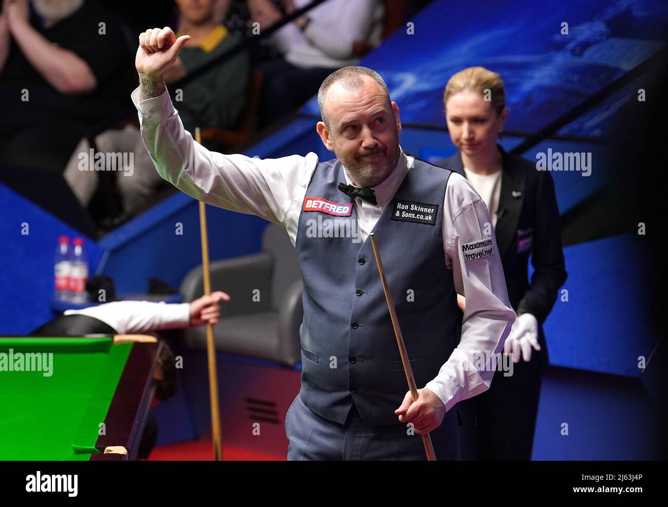 Mark Williams waves to the crowd after winning his quarter-final match against Yan Bingtao, during day twelve of the Betfred World Snooker Championship at The Crucible, Sheffield
