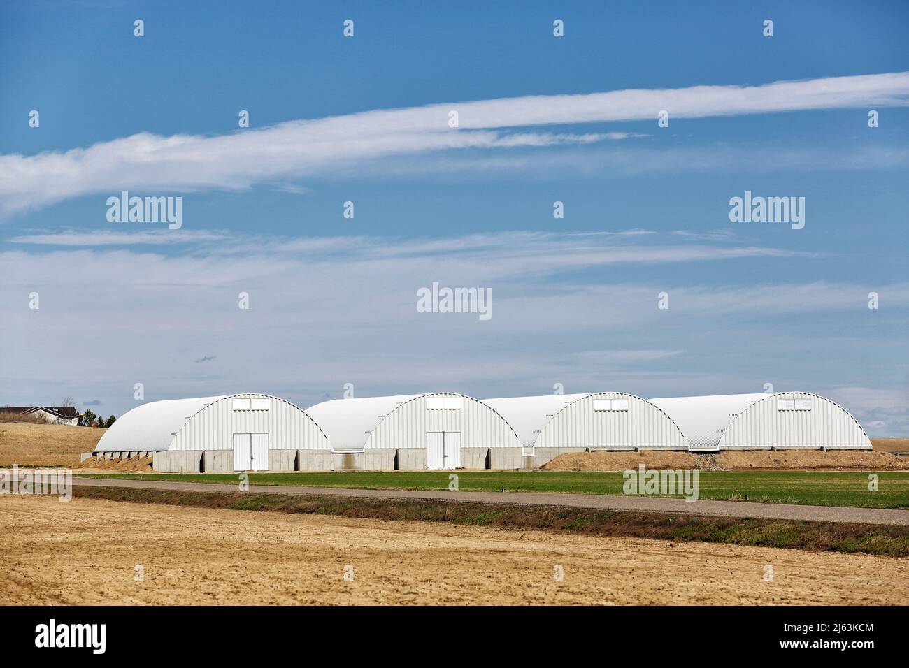 A row of modern humidity and temperature controlled, corrugated metal