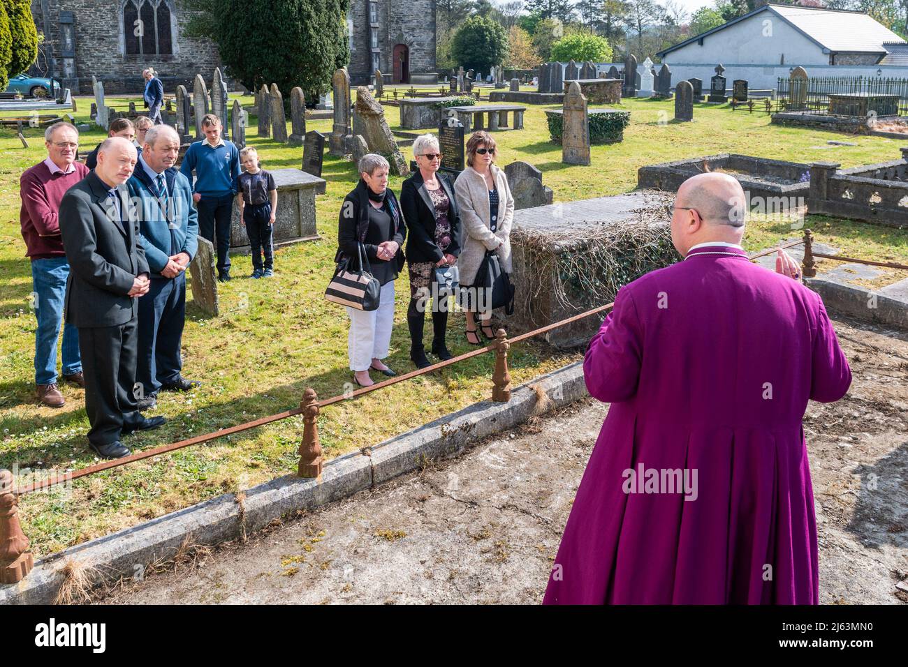 Dunmanway, West Cork, Ireland. 27th Apr, 2022. Today is the 100th Anniversary of the Bandon Valley killings, where 3 men from Dunmanway were shot dead. Bishop of Cork, Cloyne and Ross, Dr. Paul Colton, speaks before laying a wreath on the grave of 72 year old victim Francis Fitzmaurice. Credit: AG News/Alamy Live News Stock Photo
