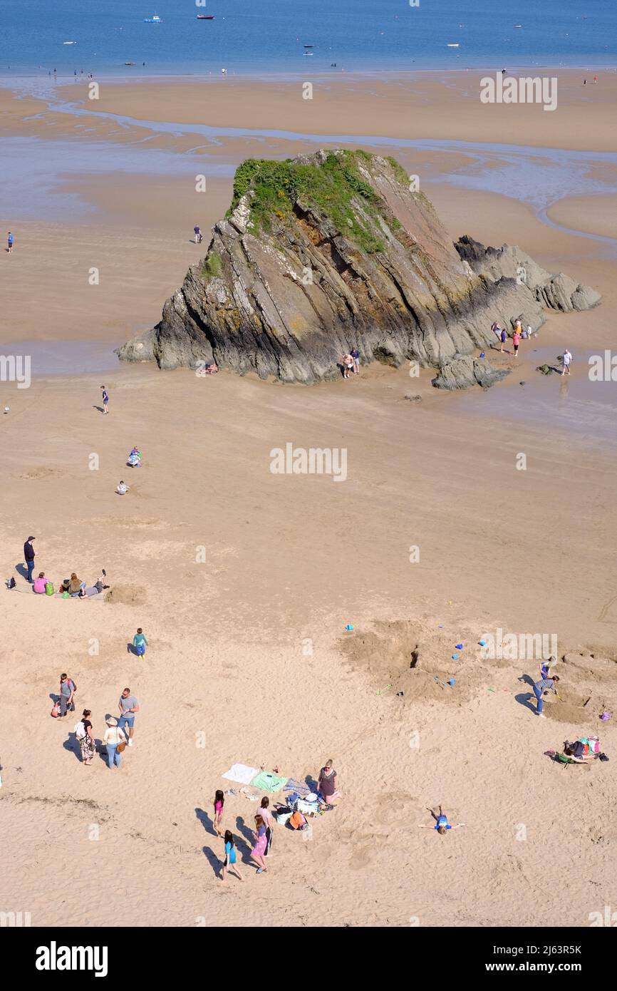 People enjoying early Spring sunny weather on Tenby North Beach, Tenby, Pembrokeshire, Wales UK Stock Photo