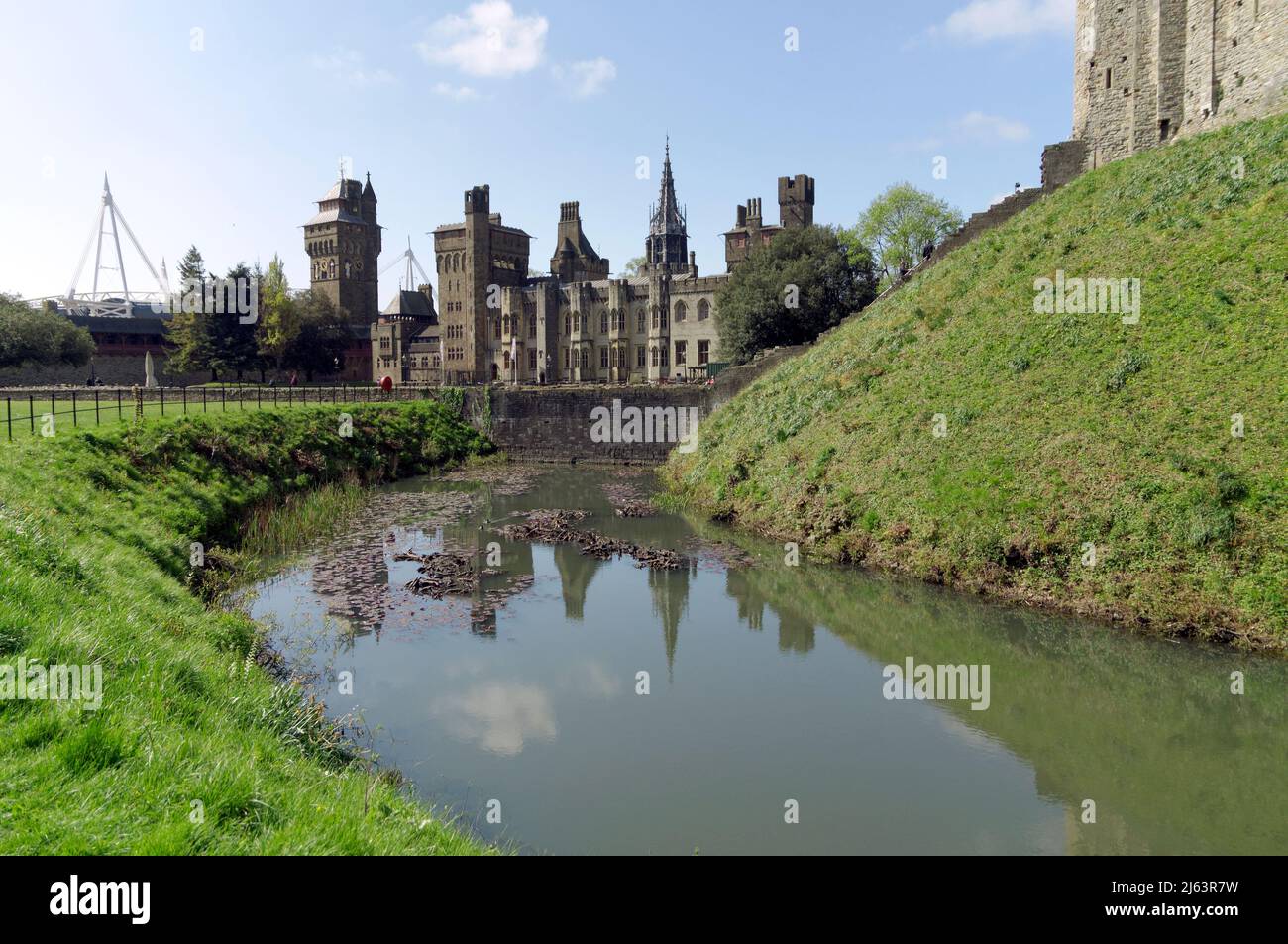 Part of Norman Keep and moat, Cardiff Castle, Spring 2022. Millennium Stadium in the distance on the left. Stock Photo