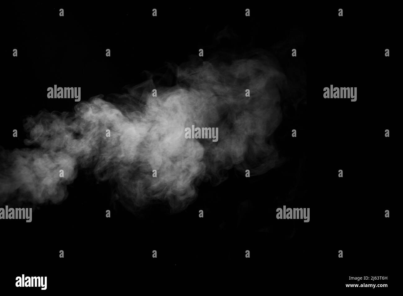 Swirling wriggling smoke steam isolated on a black background for