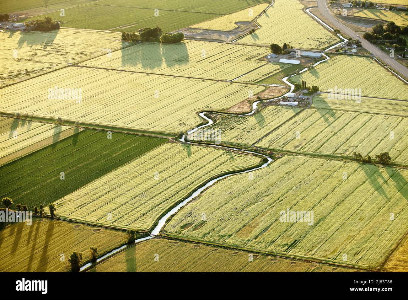 An aerial view of farmland and irrigation canals running throught the fields. Stock Photo