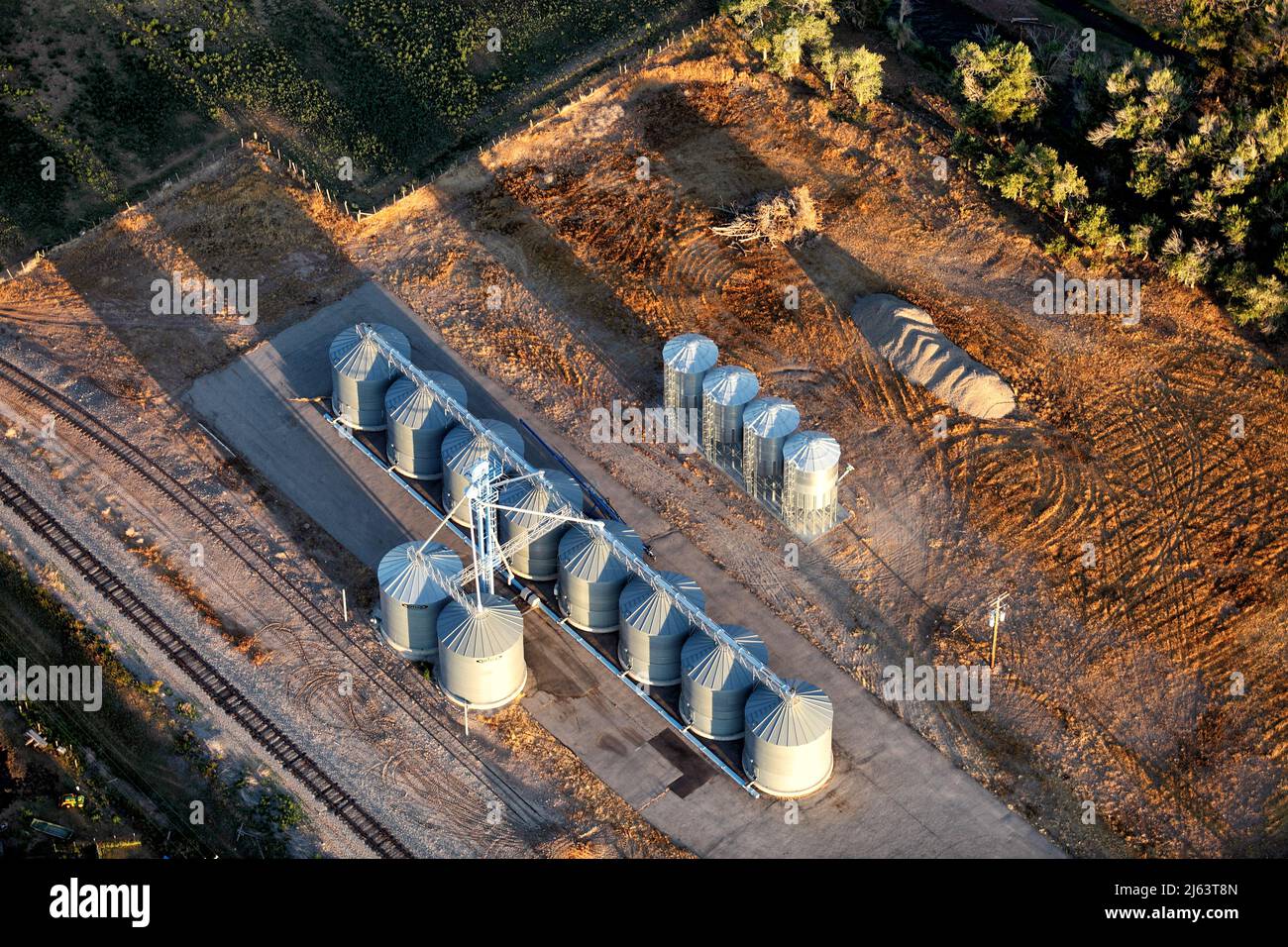 An aerial view of storage silos on a farm. Stock Photo
