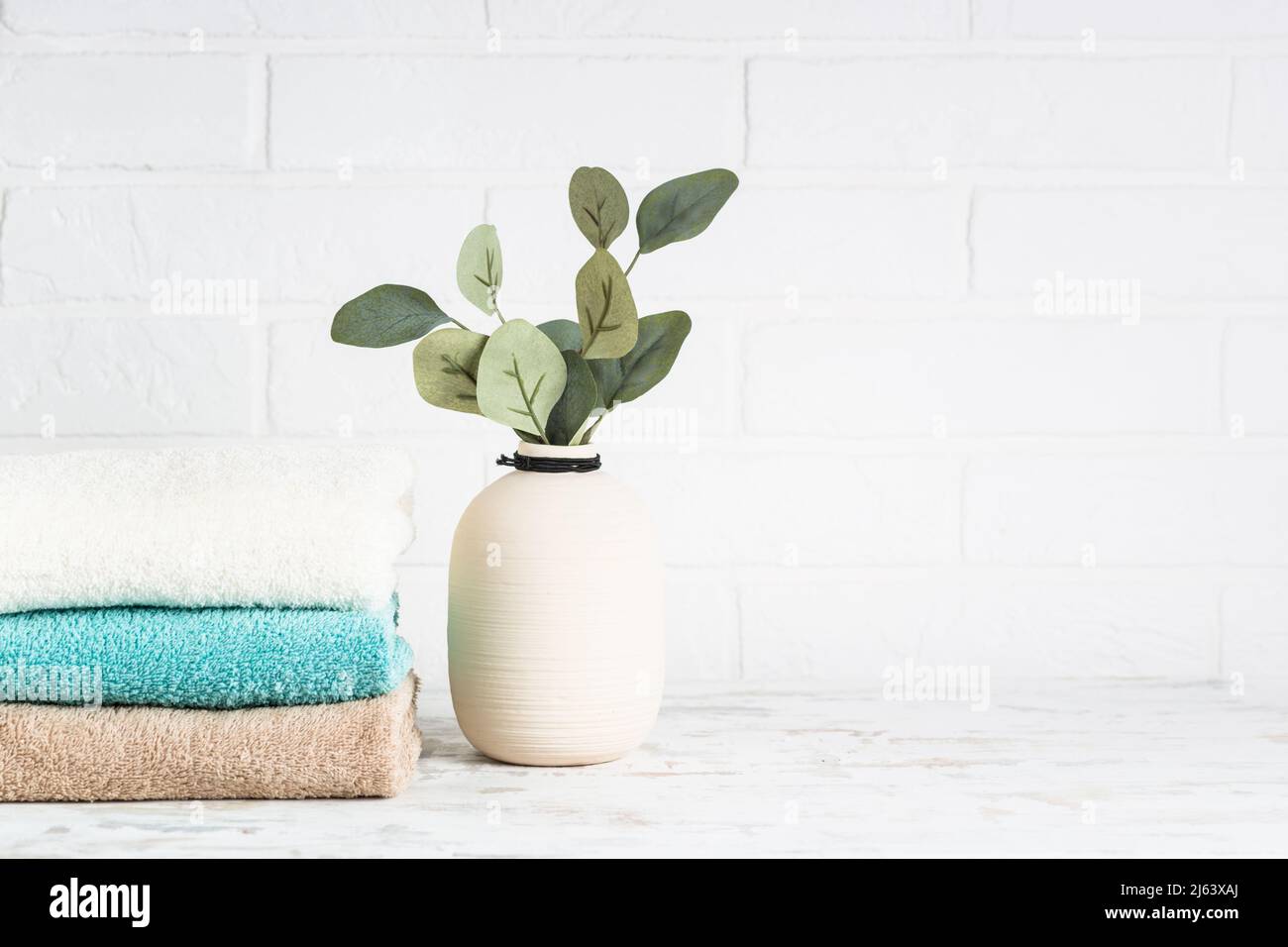 Stack of bath towels in white bathroom Stock Photo Alamy