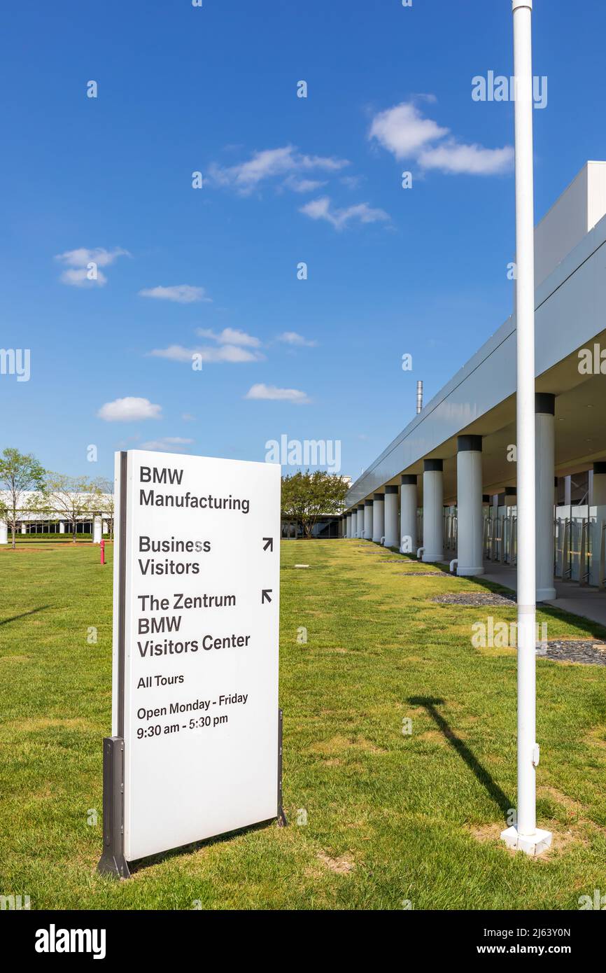 GREER, SC, USA 24 APRIL 2022: Monument sign at BMW manufacturing facility with directions to Business Visitors and The Zentrum BMW Visitors Center. Stock Photo