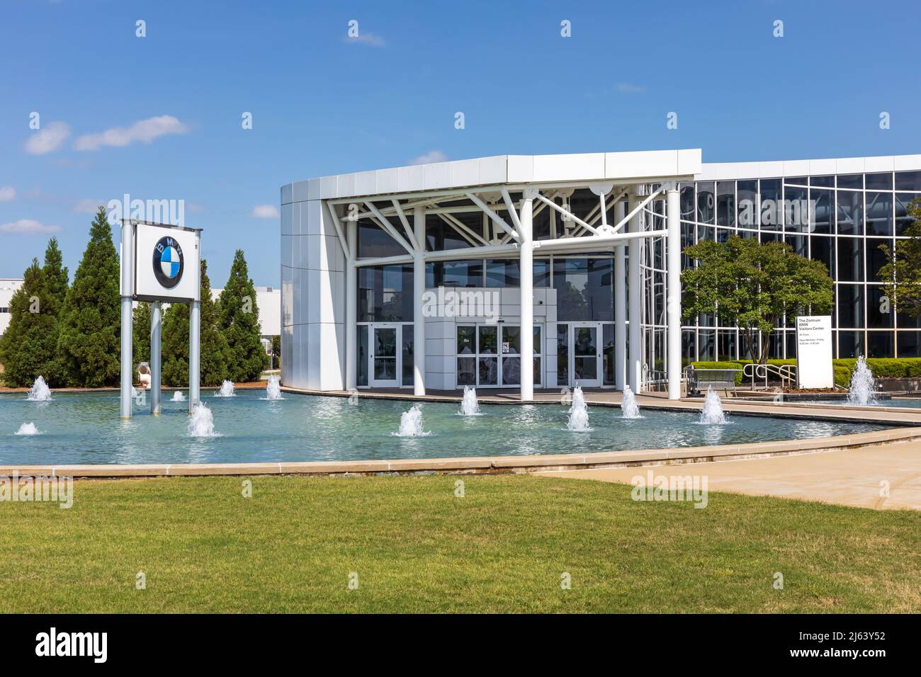 GREER, SC, USA 24 APRIL 2022: Closeup view of BMW Zentrum Visitors Center, showing building, water feature and BMW monument sign. Stock Photo
