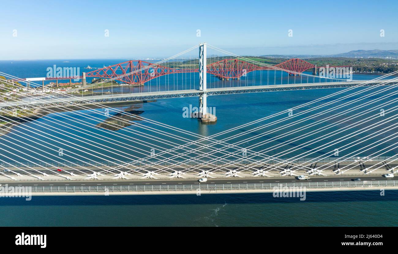 Scotland, UK. 27th April 2022. The Three bridges that cross the Firth of Forth between North and South Queensferry are isolated in this image shot from a drone.  Iain Masterton/Alamy Live News Stock Photo