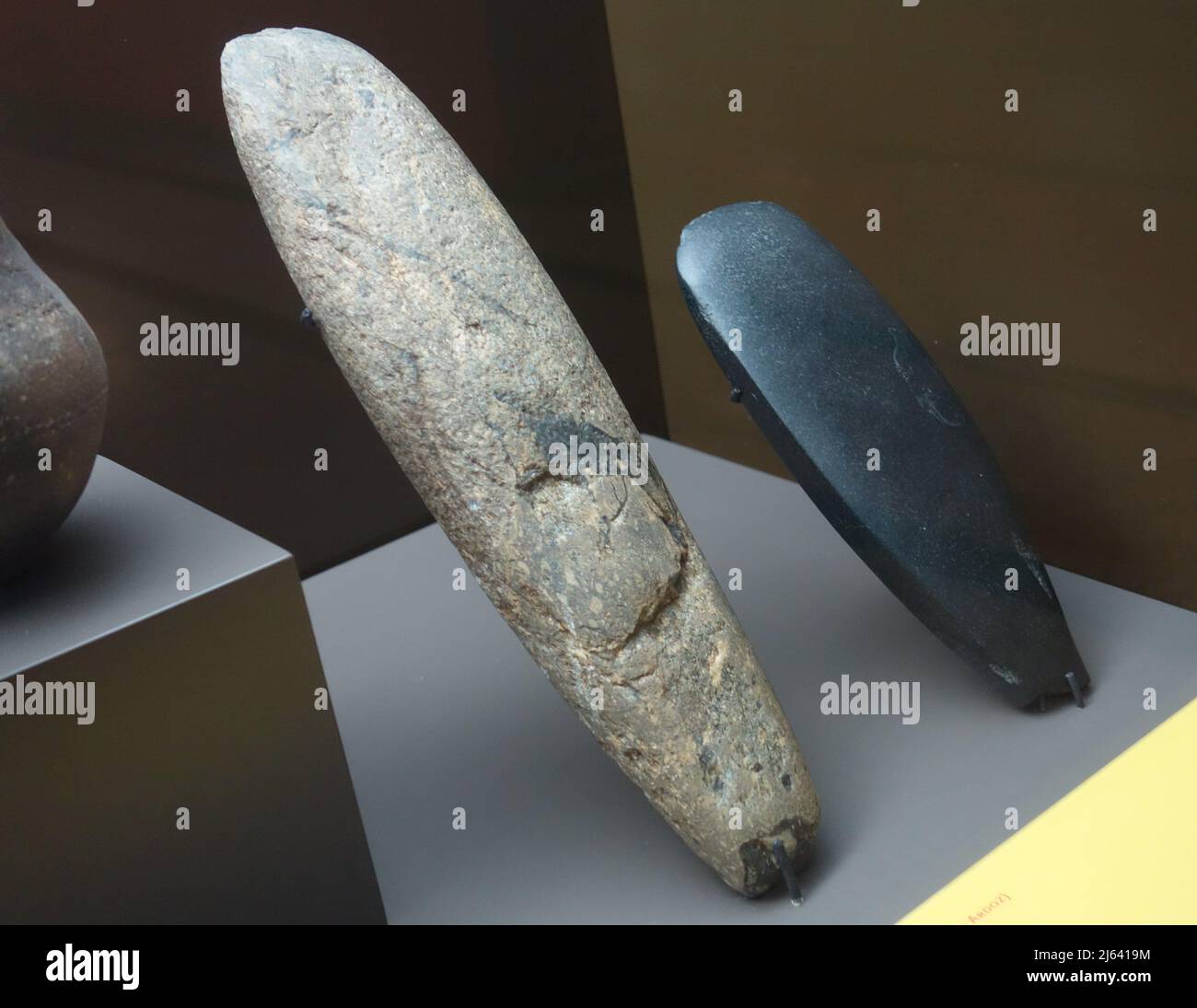 Regional Archaeology Museum in Alcala de Henares Spain. Left, polished lithic tool (Soto del Henares) right Pulished Ax (Cueva de la Ventana) Stock Photo