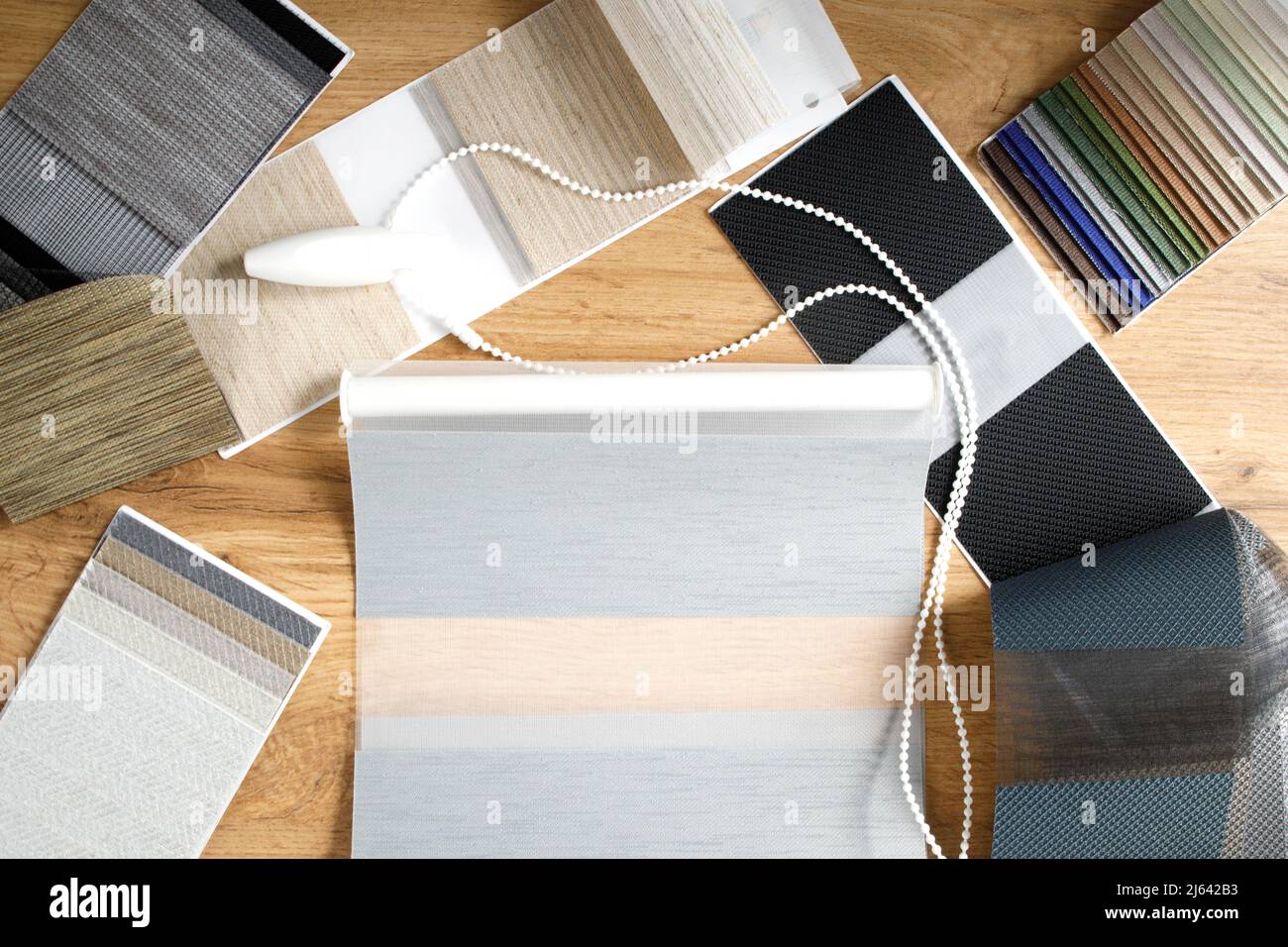 Samples of fabrics of different textures and colors in the form of a ...