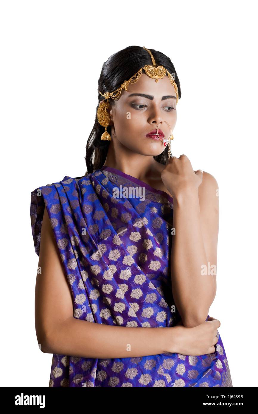 an indian girl wearing a traditional indian blue saree and simple jewellry  Stock Photo - Alamy