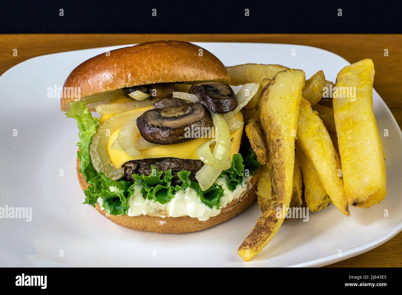 cheese burger top with sauteed onions and mushrooms Stock Photo Alamy